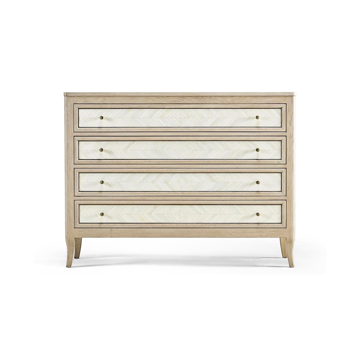 A luxurious addition to your home decor that exudes quality, design, and function. Expertly crafted by furniture artisans, this dresser is a testament to their skilled craftsmanship and attention to detail.

Featuring chevron bone inlay drawer