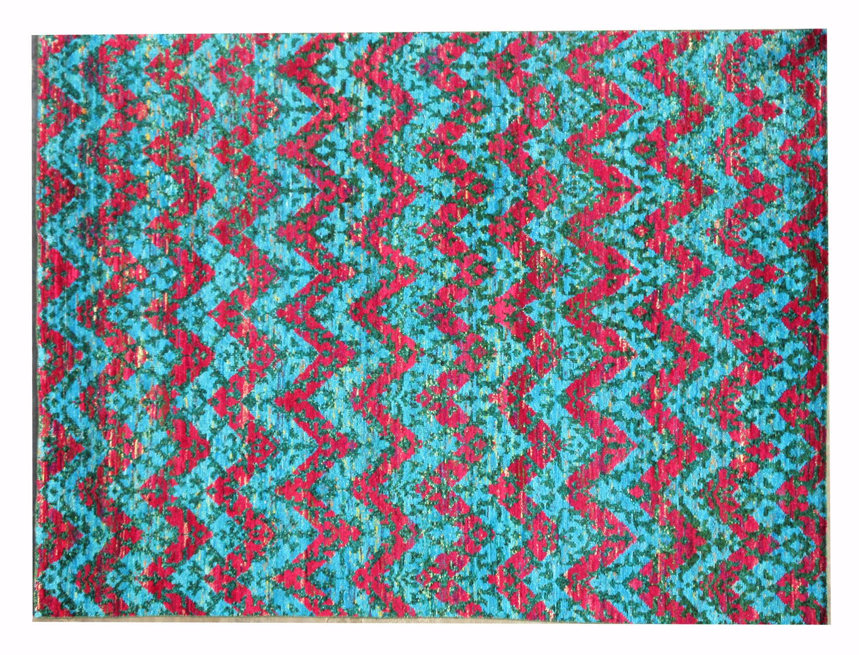 Hand-knotted silk pile on a cotton foundation.

Modern Chevron Design

Origin: India

Field color: multicolored.

Accent colors: blue, green, red, yellow.
