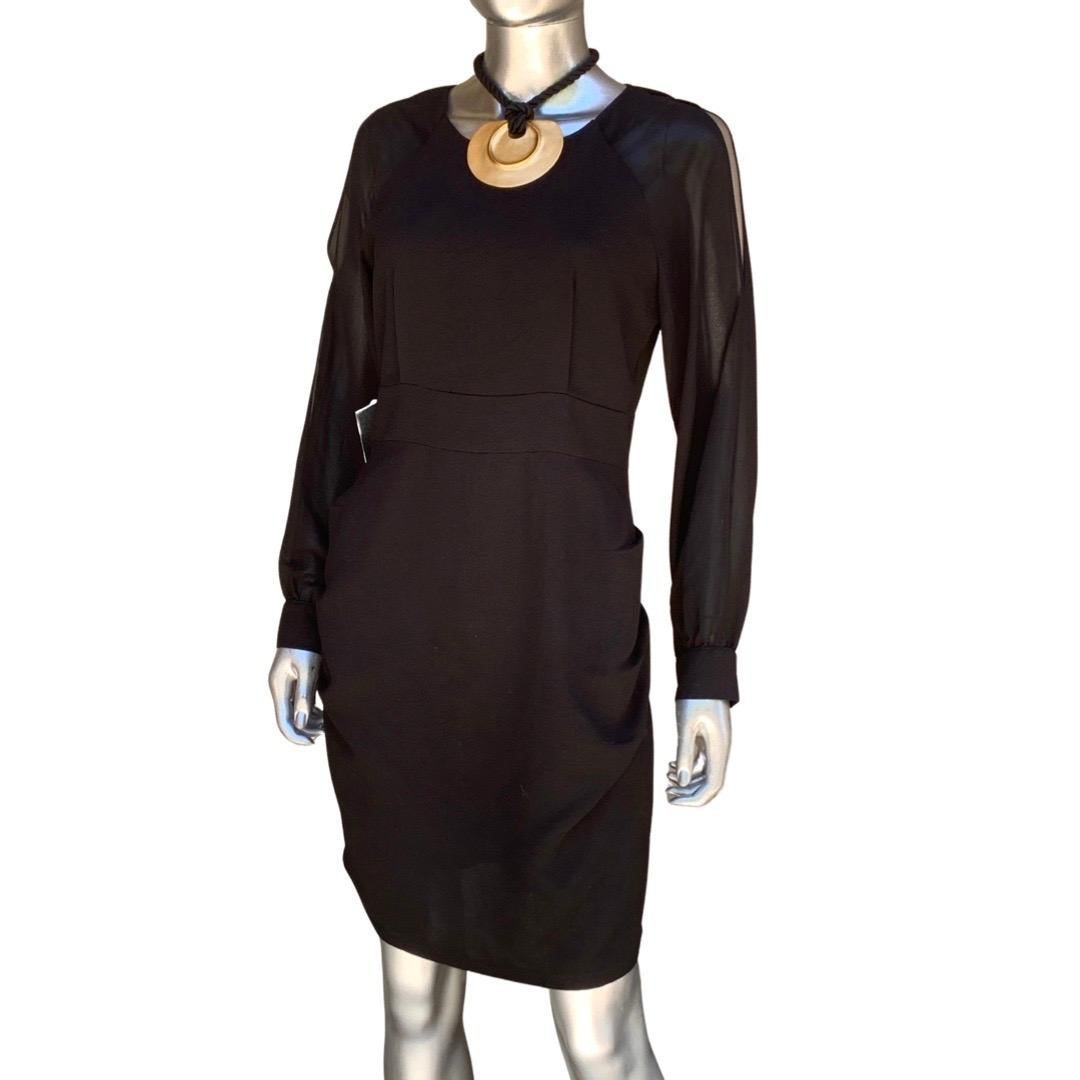 This is not just a LBD. It's a modern scuptural chic garment. The pics don't do it justice becauce it's black on black. Highlights: the sleeves are in a sheer creepe. The have peek a boo openings on the shoulder and 3 others down the sleeve. The