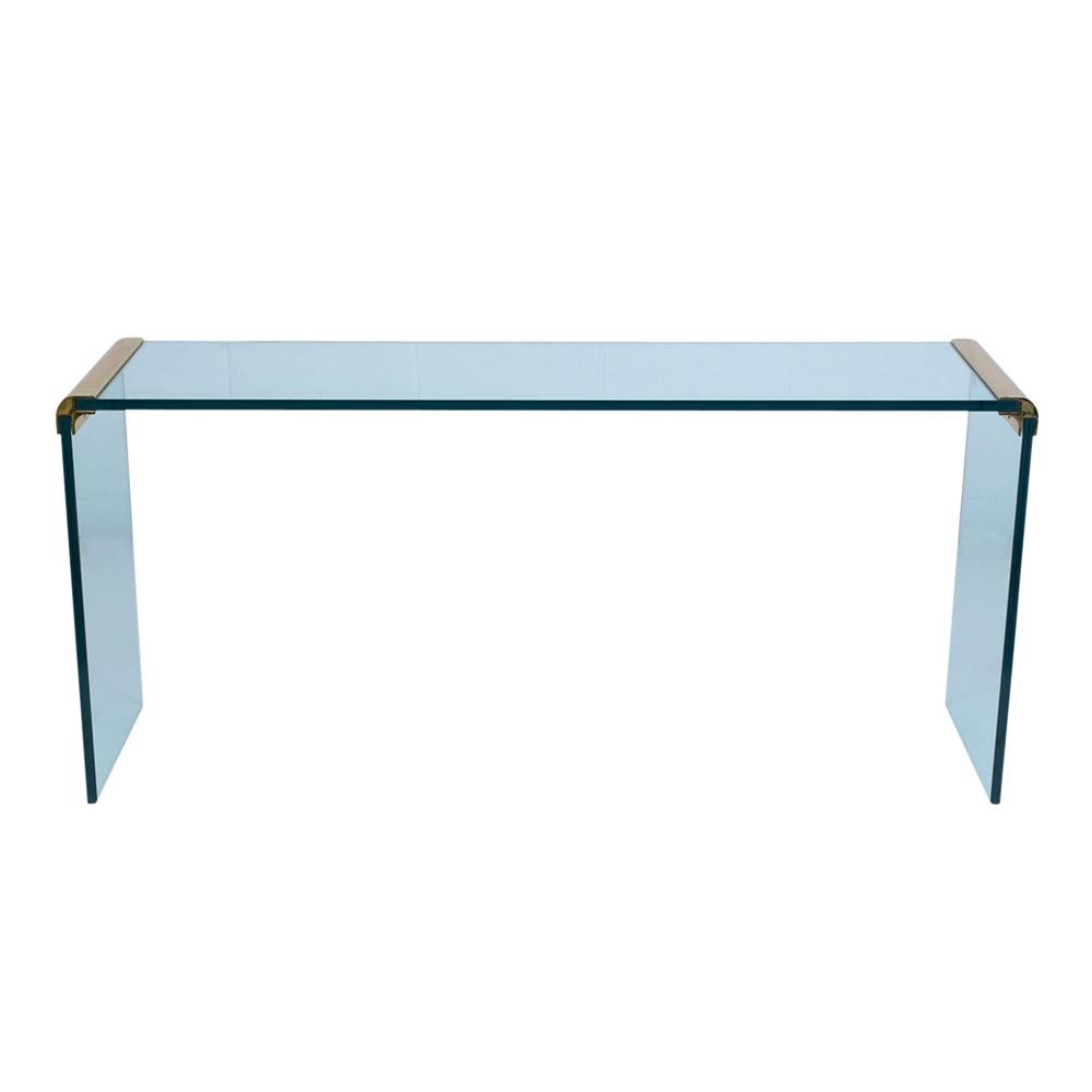 This Modern chrome and glass console table is made of 1/2 inch thick clear glass that's in very good condition and has polished curved brass molding on each side. This elegant console table is ready to be enjoyed and used in any office or home for
