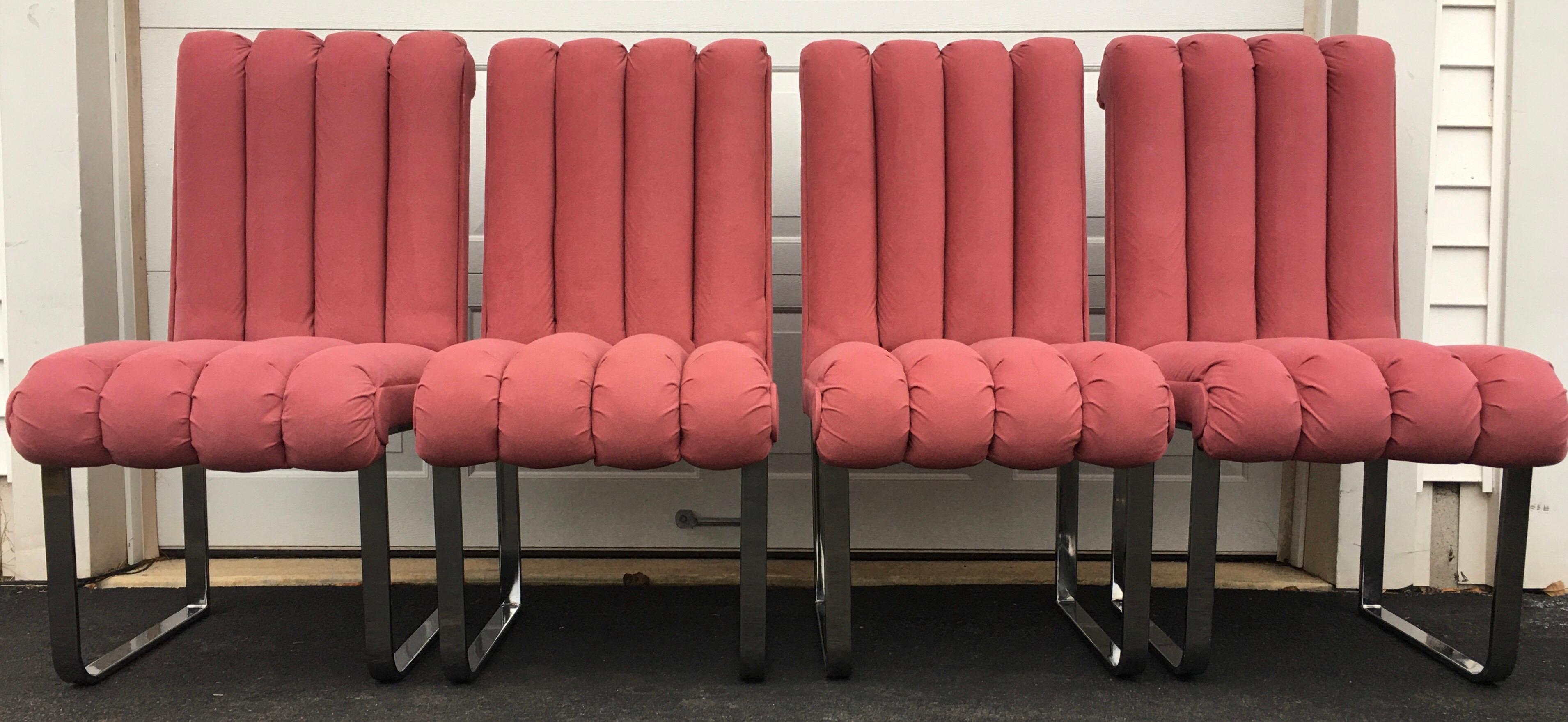 Set of four sculptural post modern dining chairs by DIA, Design Institute America. Sculptural channeled backs and seats feature original pink Ultrasuede upholstery and chrome flat bar legs. Stuffing is plush and comfortable. 

Also makes a unique De