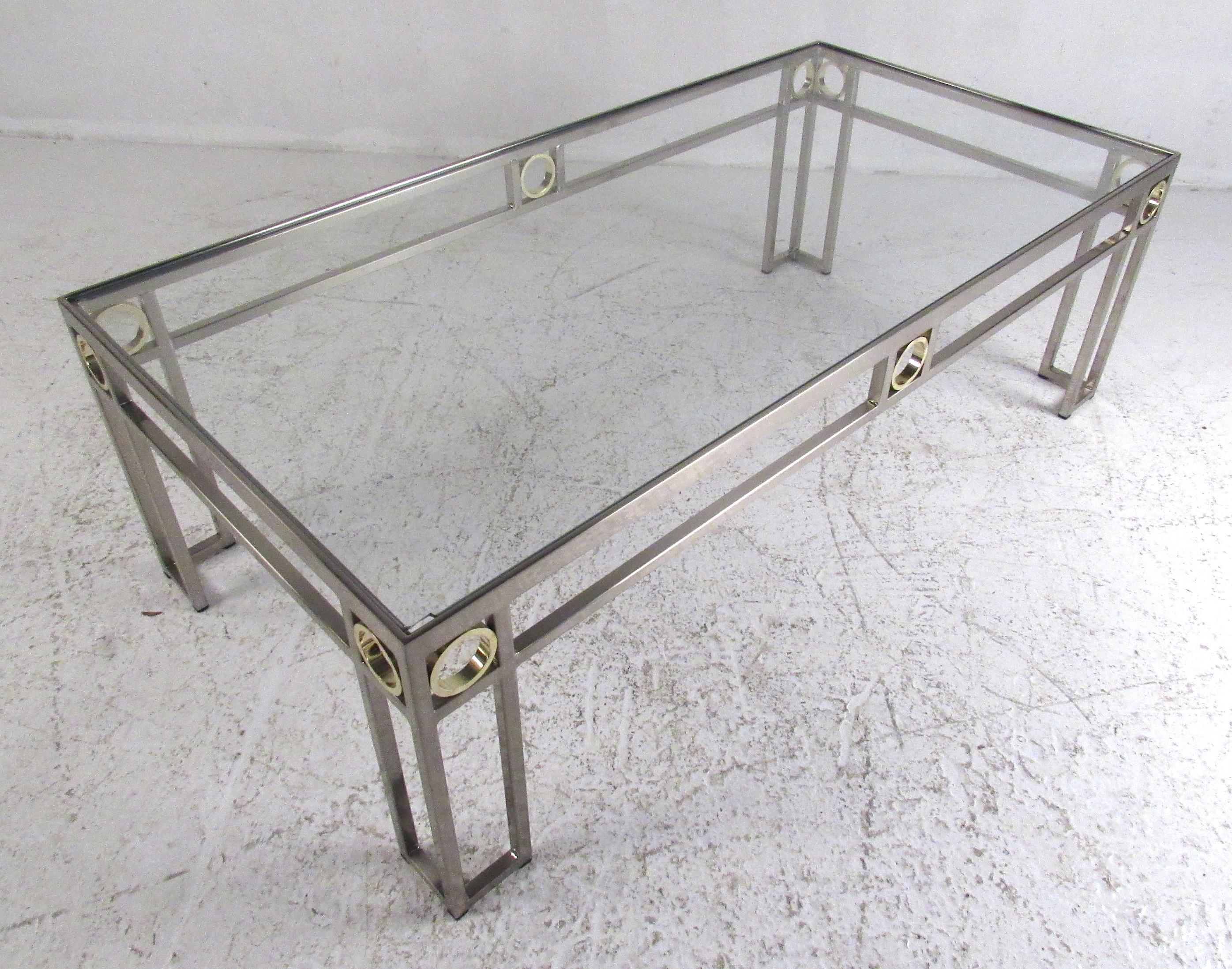 Mid-Century Modern style chrome finish coffee table with brass accents. Please confirm item location (NY or NJ) with dealer.