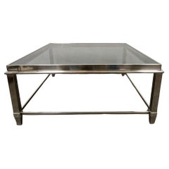 Mesa de centro moderna cromada con tapa de cristal negro