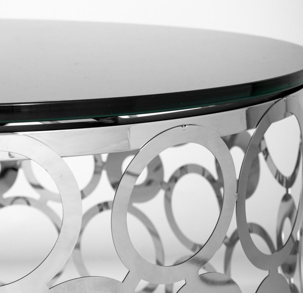 Modern chrome reticulated drum table with circular black glass top.

Dealer: S138XX