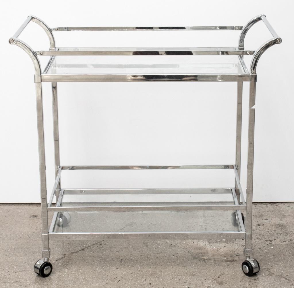 Modern Chrome & Glass Two-Tiered Bar Cart, on four caster wheels.

Dealer: S138XX
