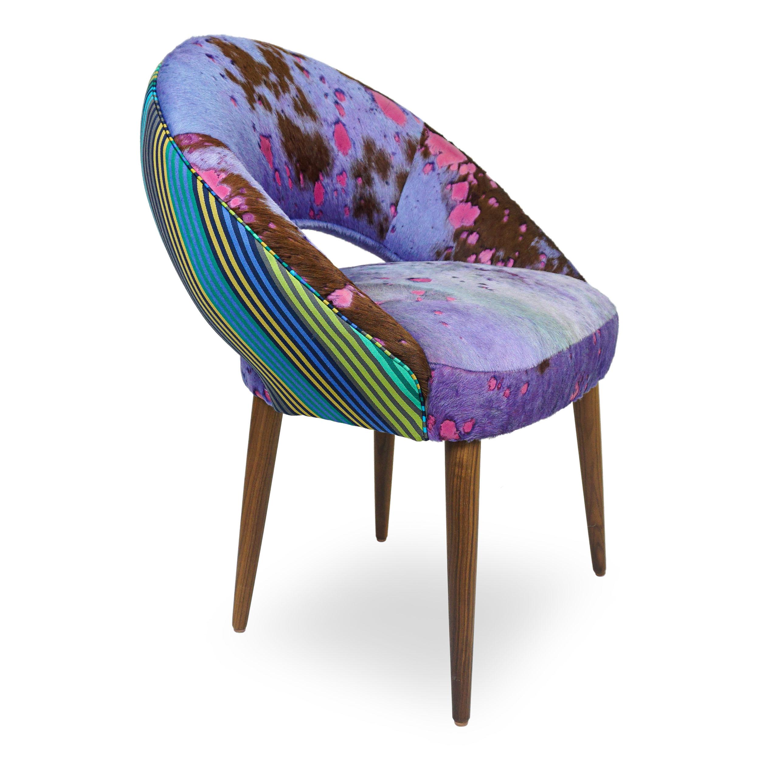 Inspired by seating found in the Paris Metro, our Meteor dining chairs are a complimentary mix of modern comfort and Space Age chic. The circular form of the chair provides a supportive seating experience. The chairs are shown with dyed cowhide and