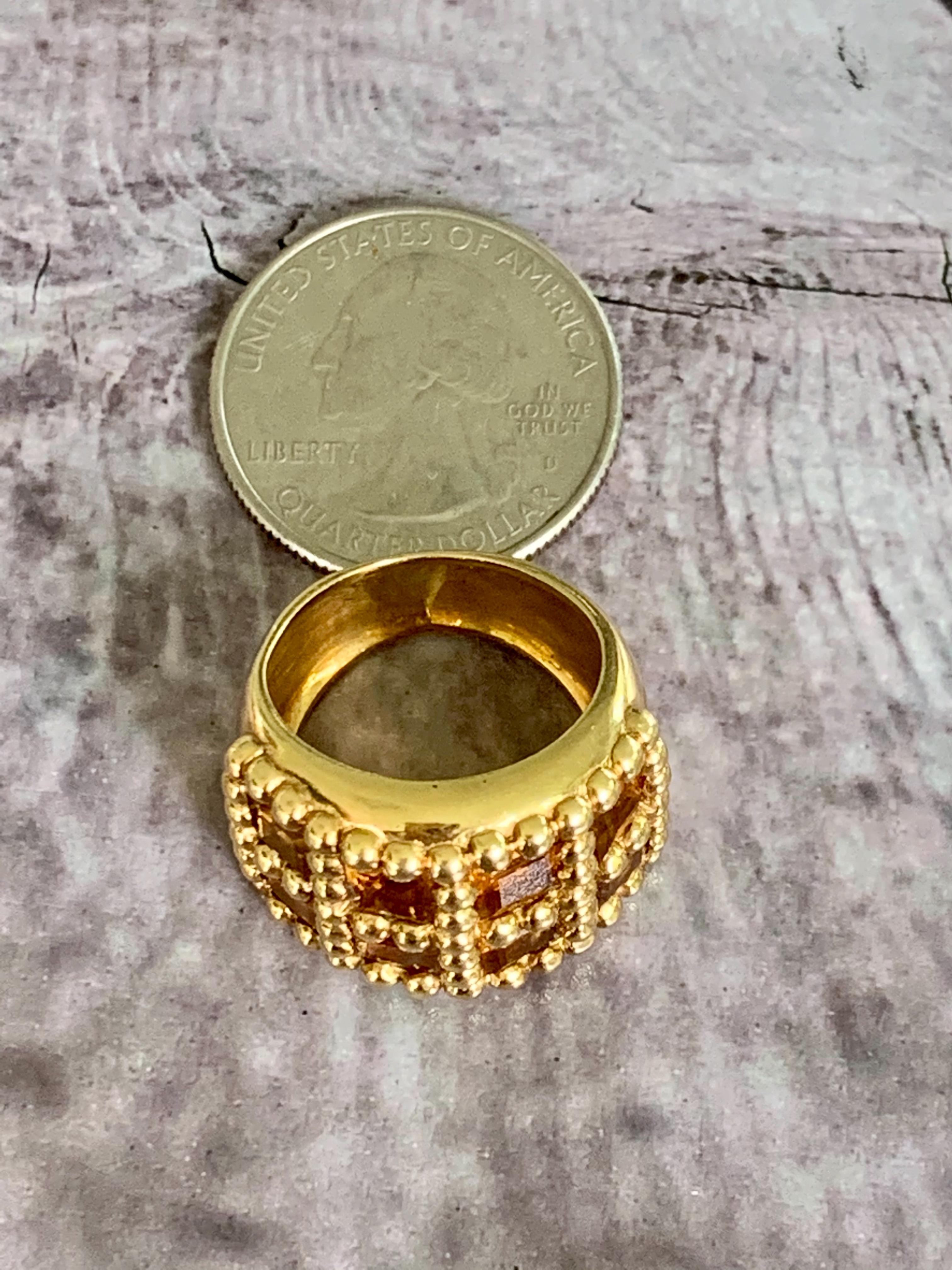 This ring features 8-5mm golden yellow, faceted Citrine stones.  The band measures 17mm wide.  

Size: 6 - this ring is sizeable but sizing services are not offered by this vendor. 
Weight: 15.4 grams