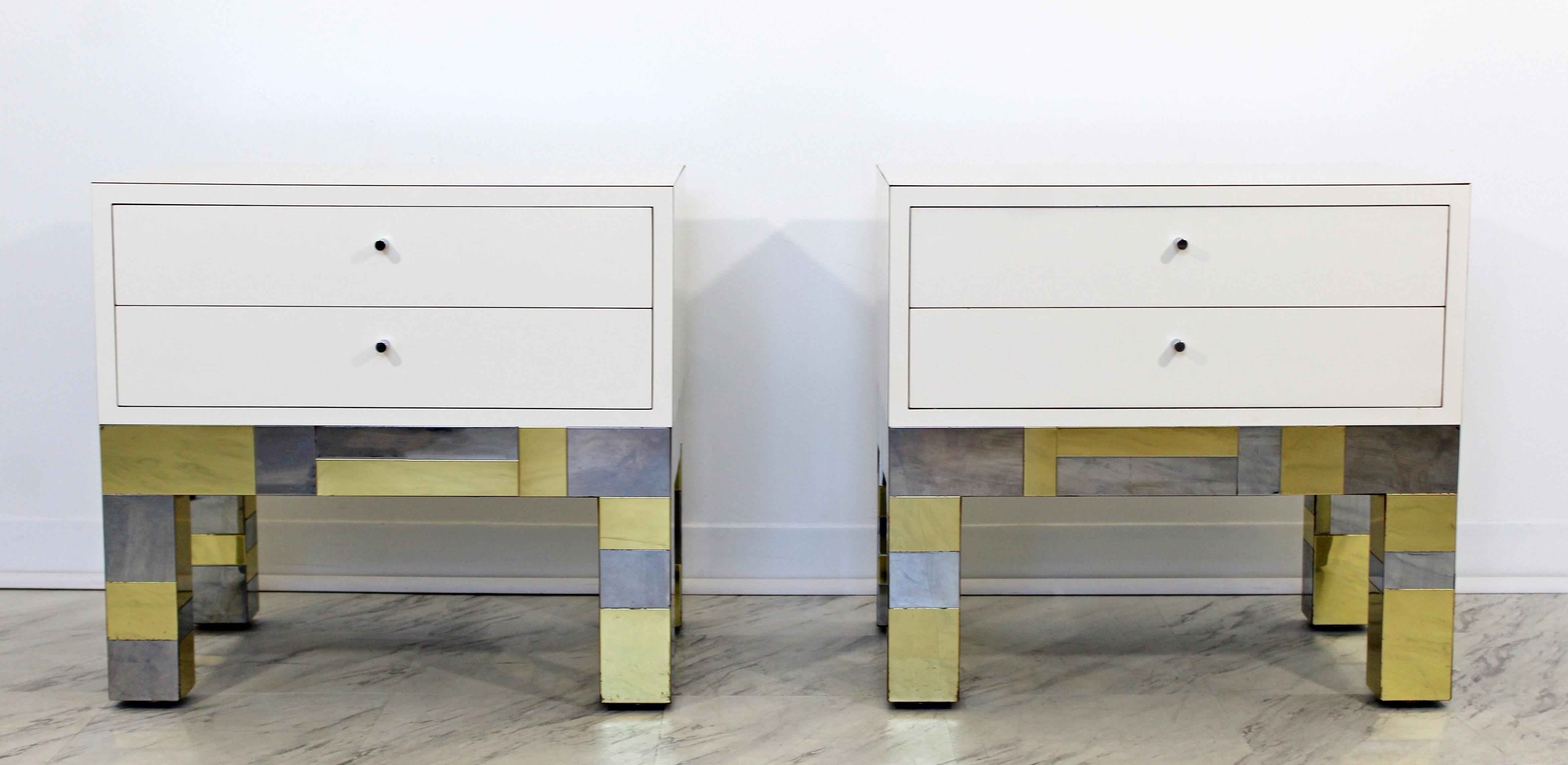 For your consideration is a phenomenal pair of Cityscape nightstands and matching headboard, made of patchwork chrome and brass. The tables have two shelves each. All three pieces are signed by Paul Evans for Directional, dated 1973. In good vintage