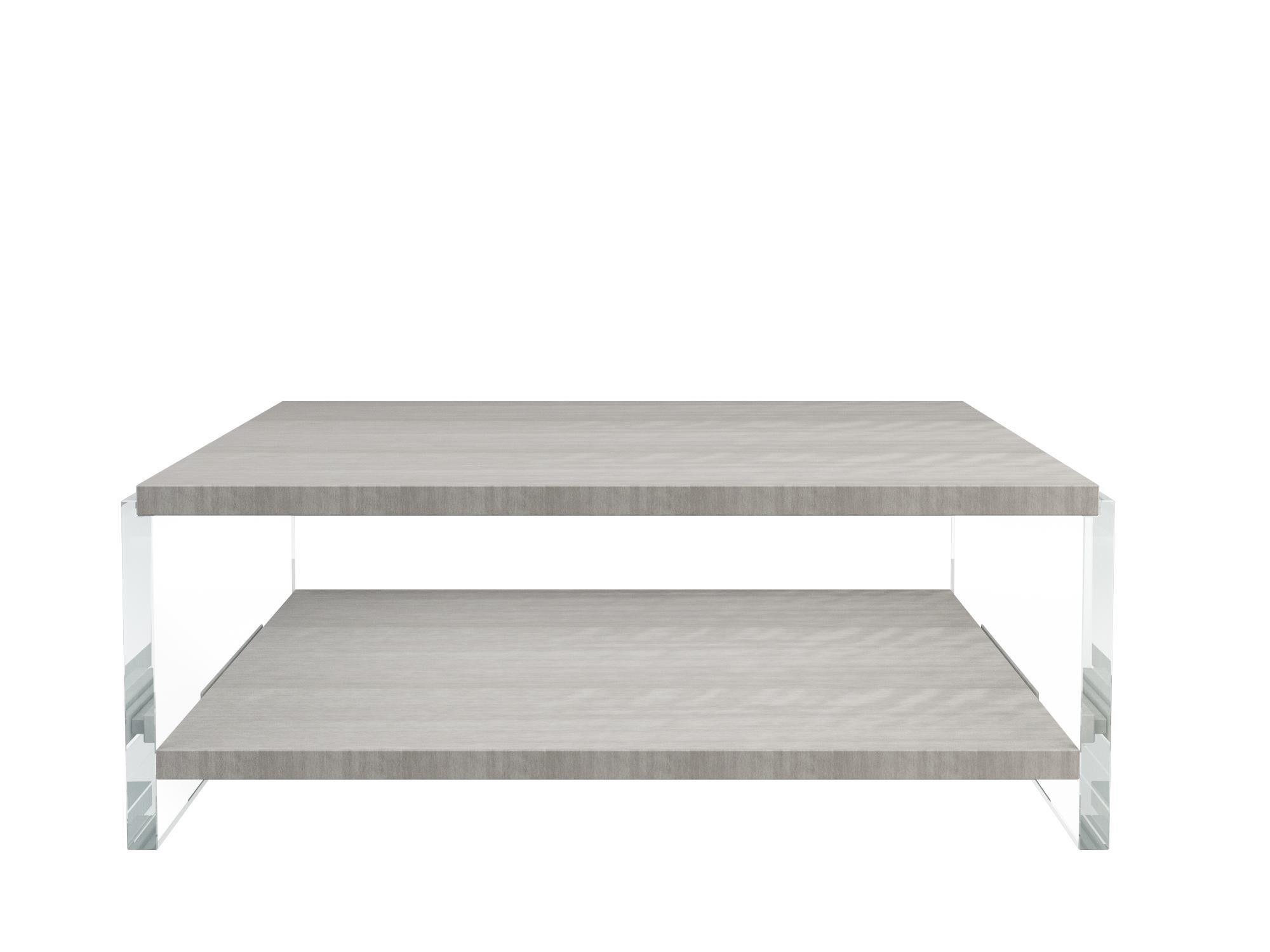 Vega cocktail table by Jonathan Franc - the figured grey dyed sycamore rectangular top is supported by two crystal clear acrylic monolith legs. Below is a gray dyed sycamore shelf. The finish on the table has been hand polished to a high gloss.