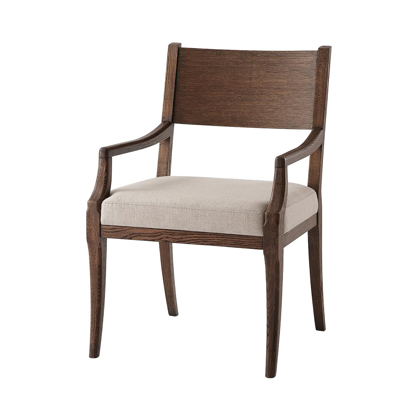 A modern classically inspired dining chair with a carved bar backrest, with a boxed and upholstered cushion seat on sabre legs with our brushed oak Charteris finish.

Armchair dimensions: 24