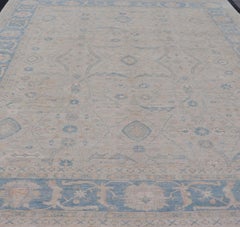 Modern Classic Oushak with Blue Colored Border and Light Cream Background