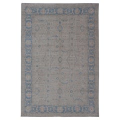 Modern Classic Oushak with Blue Colored Border and Light Cream Background