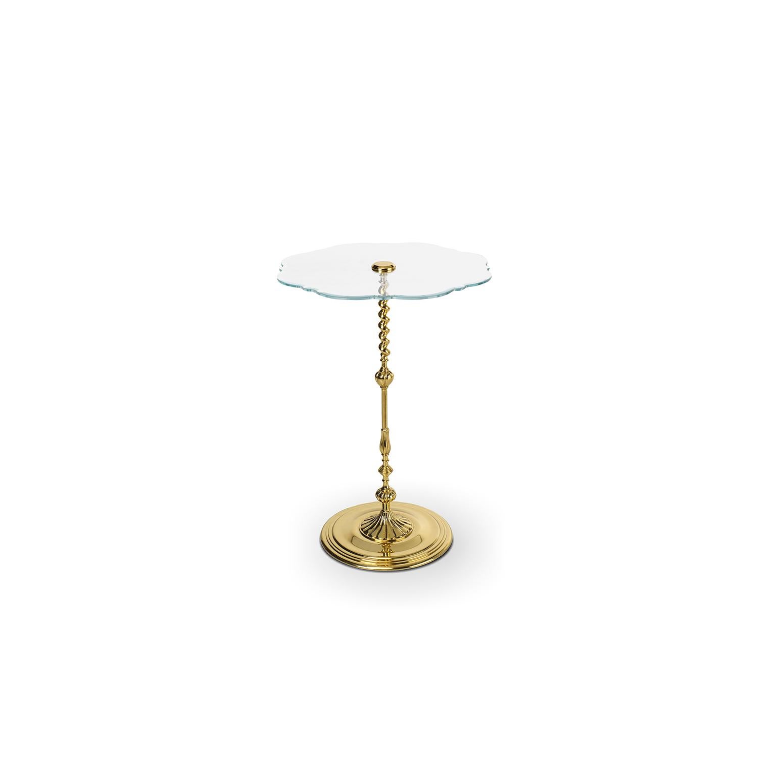 Inspiration:  
This piece is a perfect example of a classic table. Its elaborated foot and glass top design take us immediately to the past. These are small but unique details. The thin foot is made of solid brass and combines elegance with