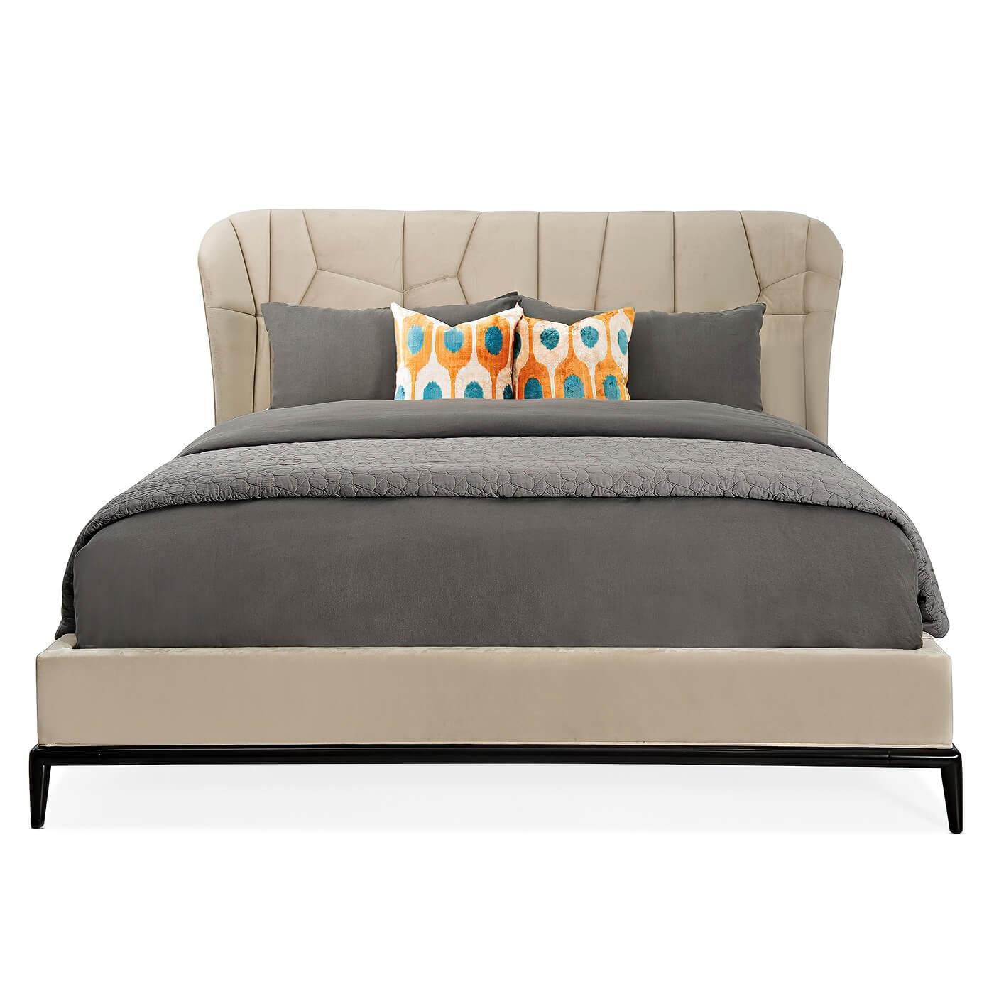 A modern classic upholstered king bed. Its bold design offers a refreshing interpretation of the wing bed and takes it to new heights with a sophisticated silhouette and custom geometric quilting. The uniquely stitched headboard features wings that