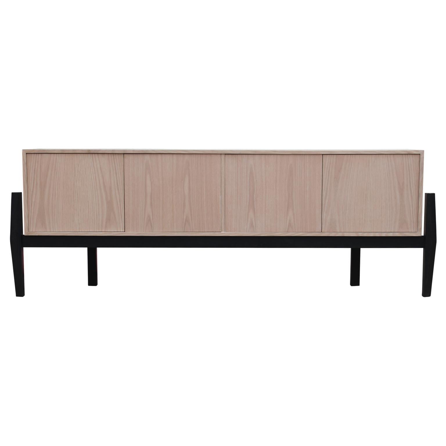 Gorgeous modern custom made-to-order two tone credenza with a natural oak finish. The finish and height can be changed if desired. The listing price is for the floor model. Please request pricing for customized options. 