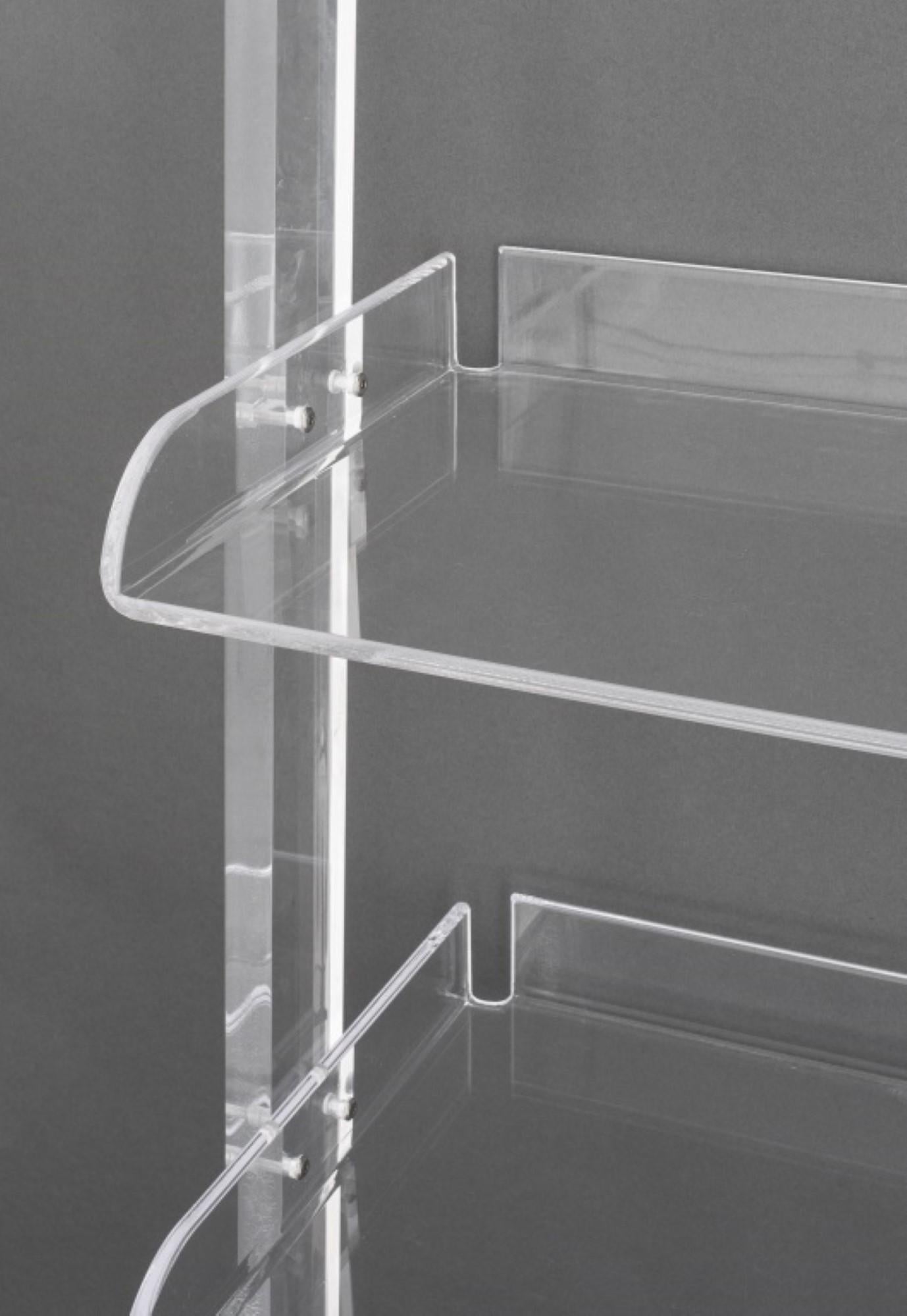 The Modern Minimalist clear acrylic ladder wall shelves have approximate dimensions of 77 inches in height, 33.75 inches in width, and 17.5 inches in depth. Please note that these dimensions are provided as approximations, and actual measurements