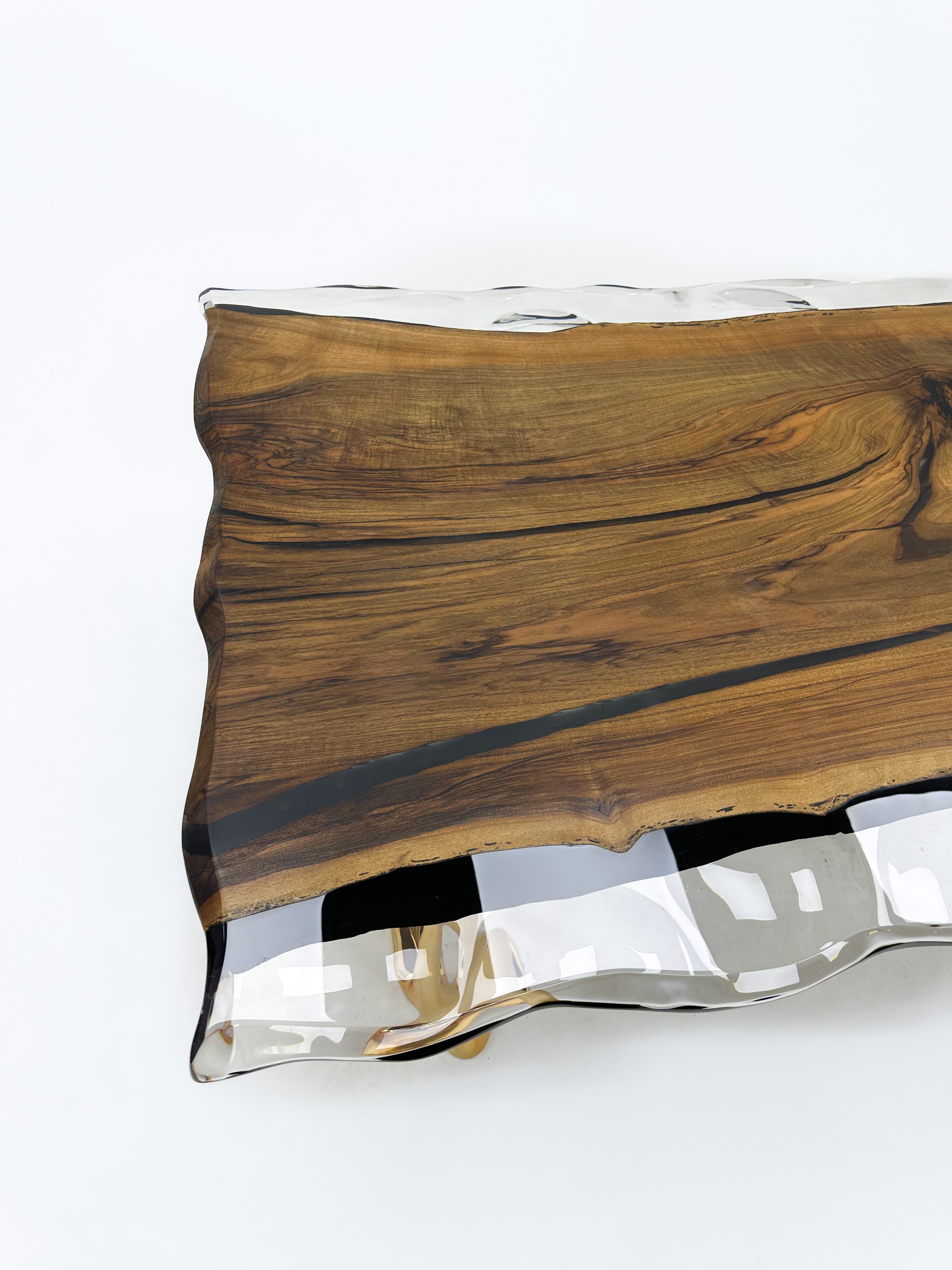 Clear Epoxy Resin Table 

Custom sizes & colours are available!

This table is made of walnut wood, selected for its unique character. What makes it special is the clear epoxy resin that beautifully covers the wood with its wave patterns, enhancing