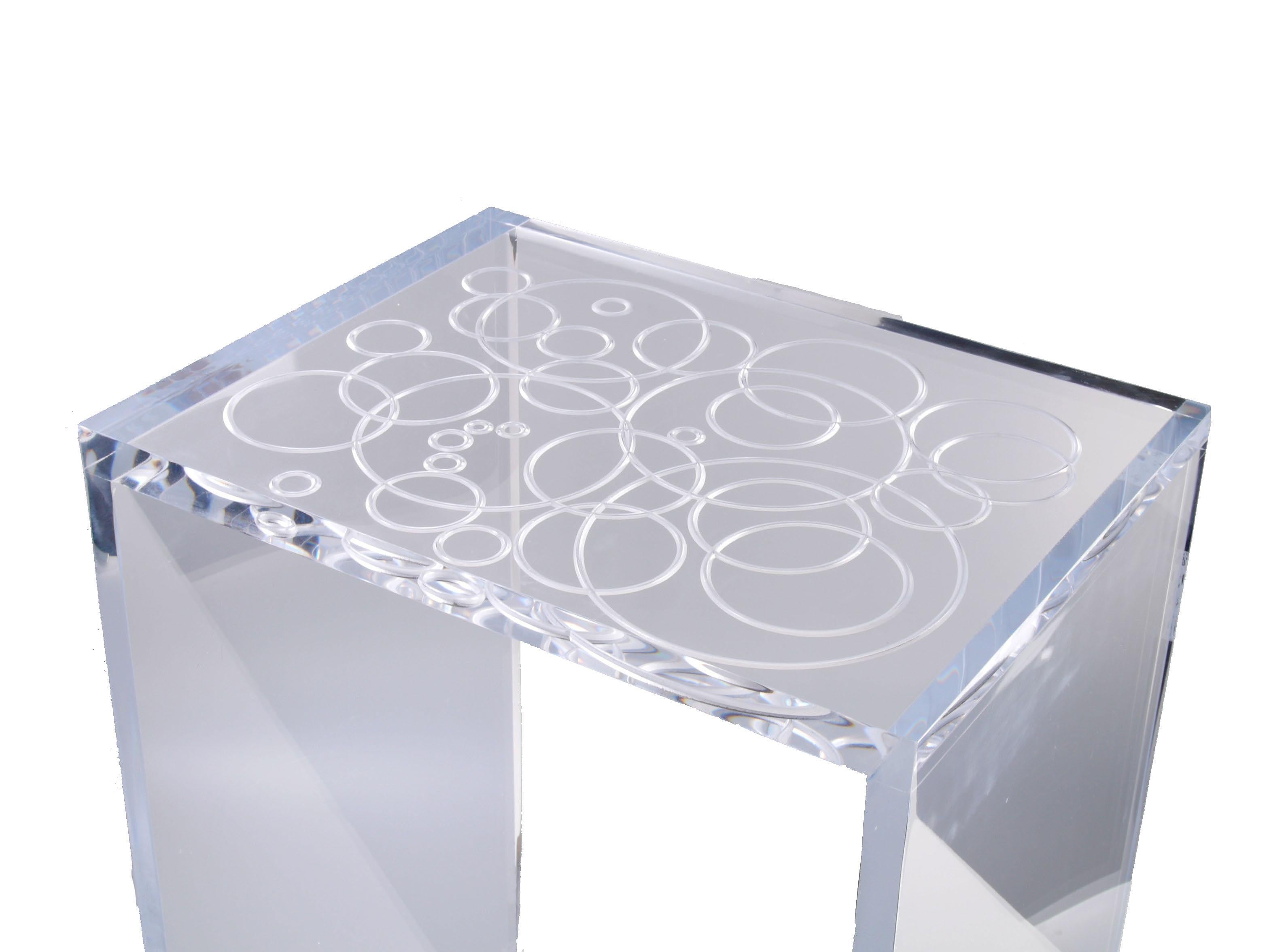 Modern clear Acrylic or Lucite side table, end table.
The top has etched details. 
Sturdy and heavy craftsmanship in clean design.