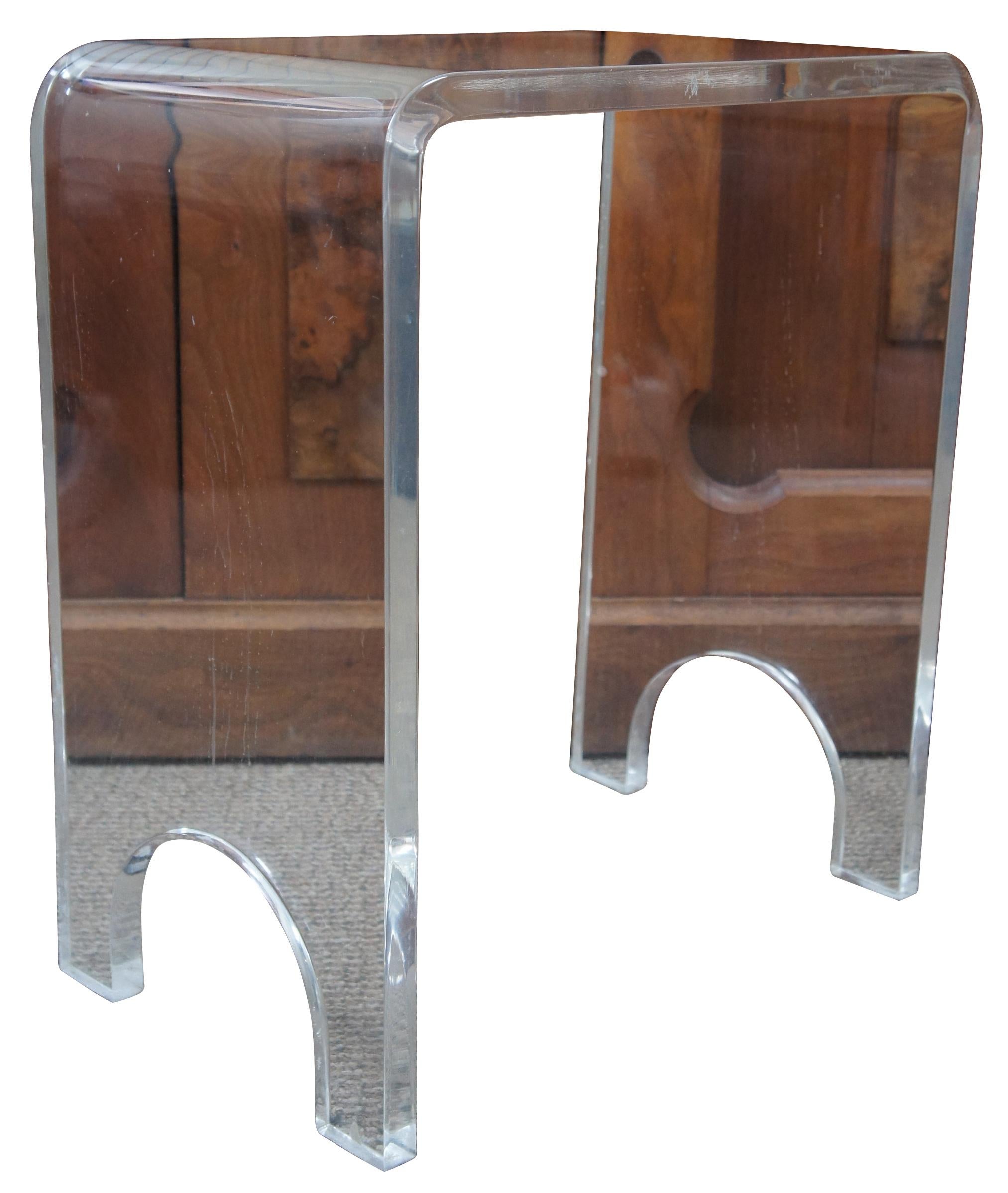 Small molded lucite side table or vanity stool with arched legs and rounded edges. Measure: 19