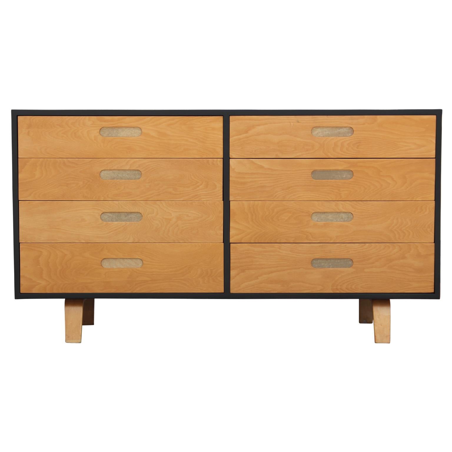 Unique and intriguing eight drawer dresser made from birch wood and refinished to be two-toned with fun spring loaded recessed pulls by Clifford Pascoe.