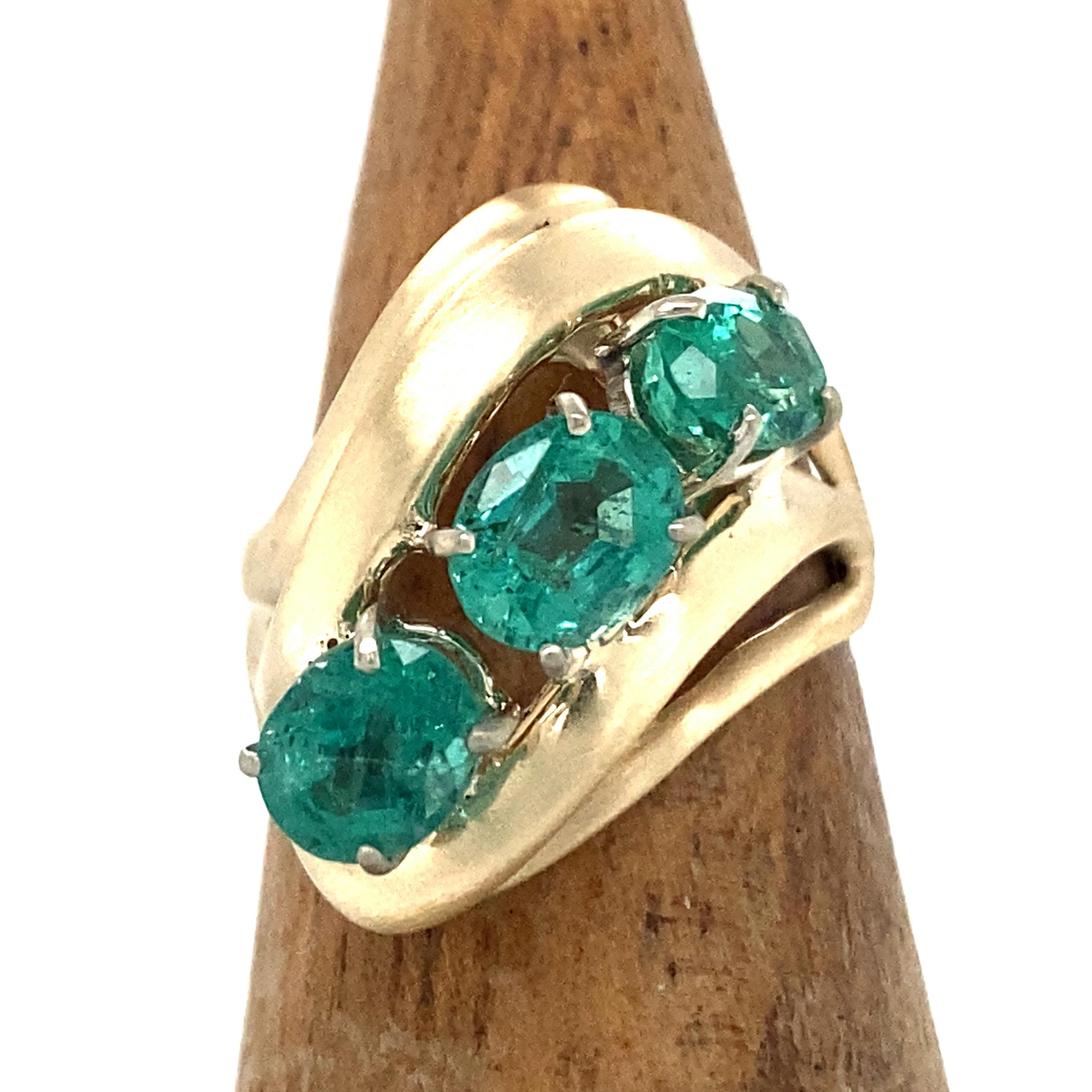 This 1970's cocktail ring came to us from a customer who wanted its original diamonds used for a custom project (with the gold mounting to be scrapped toward the final price).  We loved the groovy setting too much to consign it to the melting pot