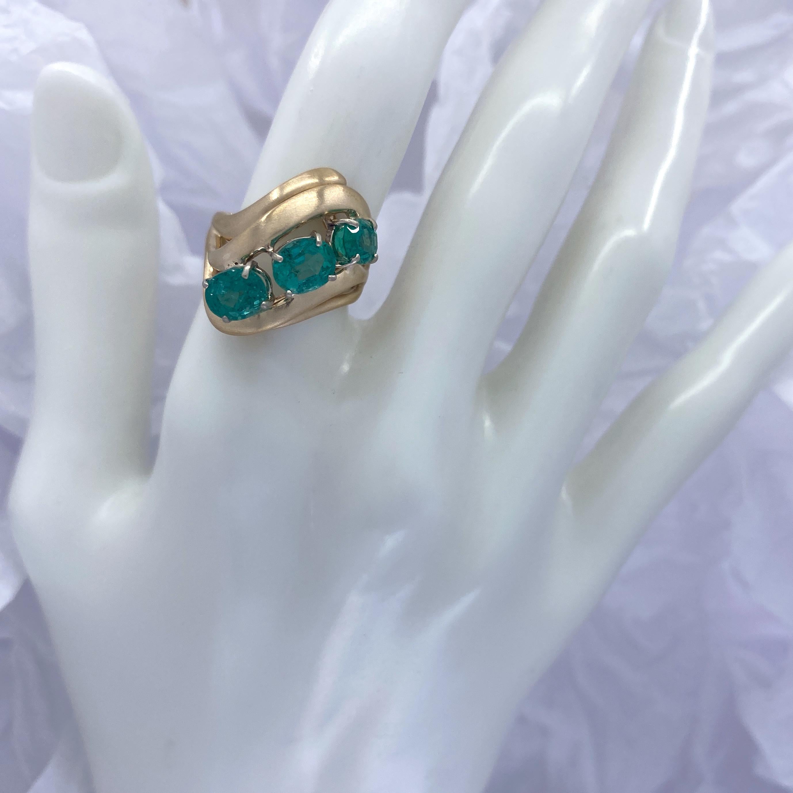 Oval Cut Modern Cocktail Ring Featuring Three Oval Emeralds in Yellow Gold, Circa 1970 For Sale