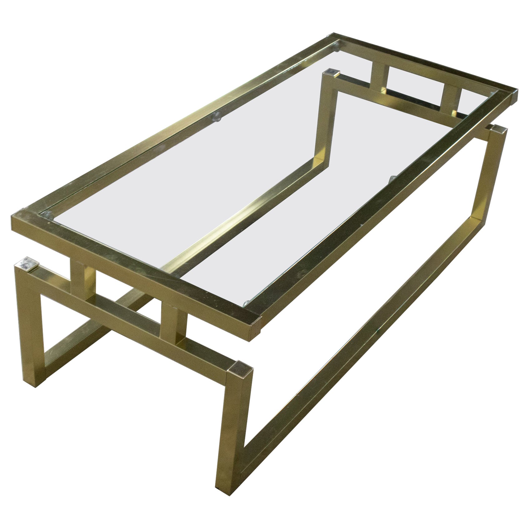 Mesa de centro moderna con estructura de aluminio anodizado en tono latón y tablero de cristal en venta
