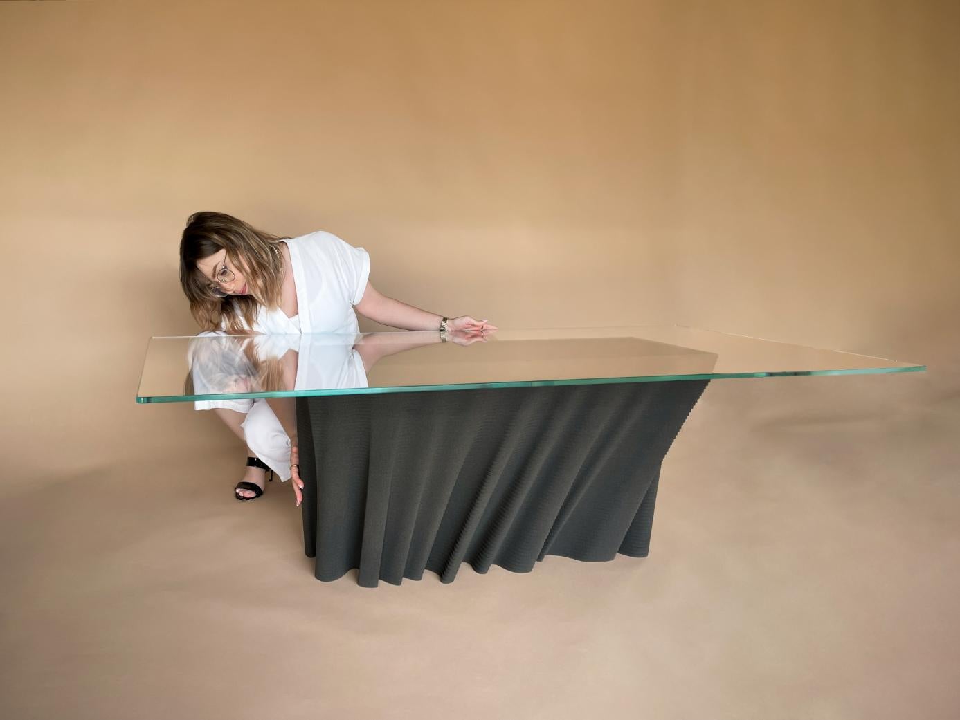 This is one of two artist's proof editions of the original DUNE table design from Christopher Duffy.

Pushing the boundaries of what’s possible, DUNE is a modern coffee table, 3D printed using black quartz sand. Beautiful, bold and dynamic…a