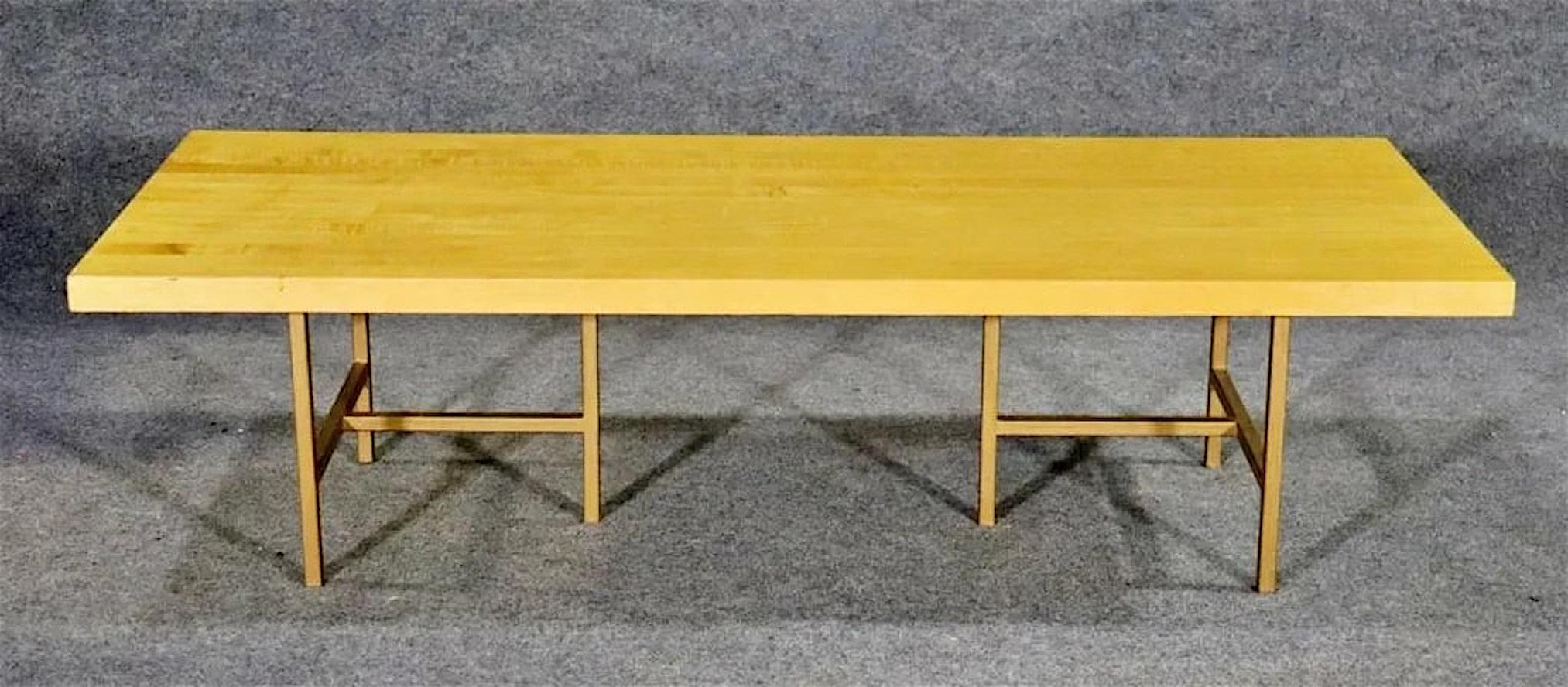 Mid-Century Modern style coffee table with butcher block wood top on a metal base.
Please confirm location NY or NJ.