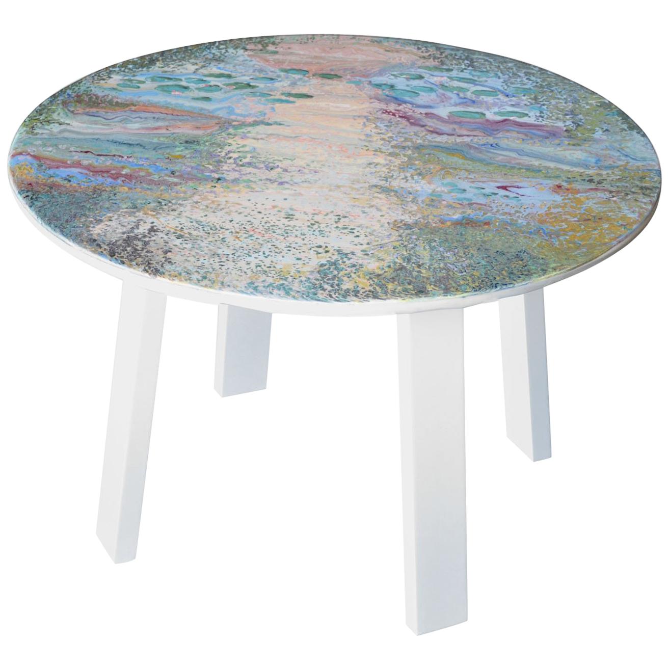 This small table made with marble top decorated entirely with scagliola, whose decoration is a tribute to the French artist Monet and resumes its famous water lilies in a rather abstract vision. The round top was deliberately made by hand leaving