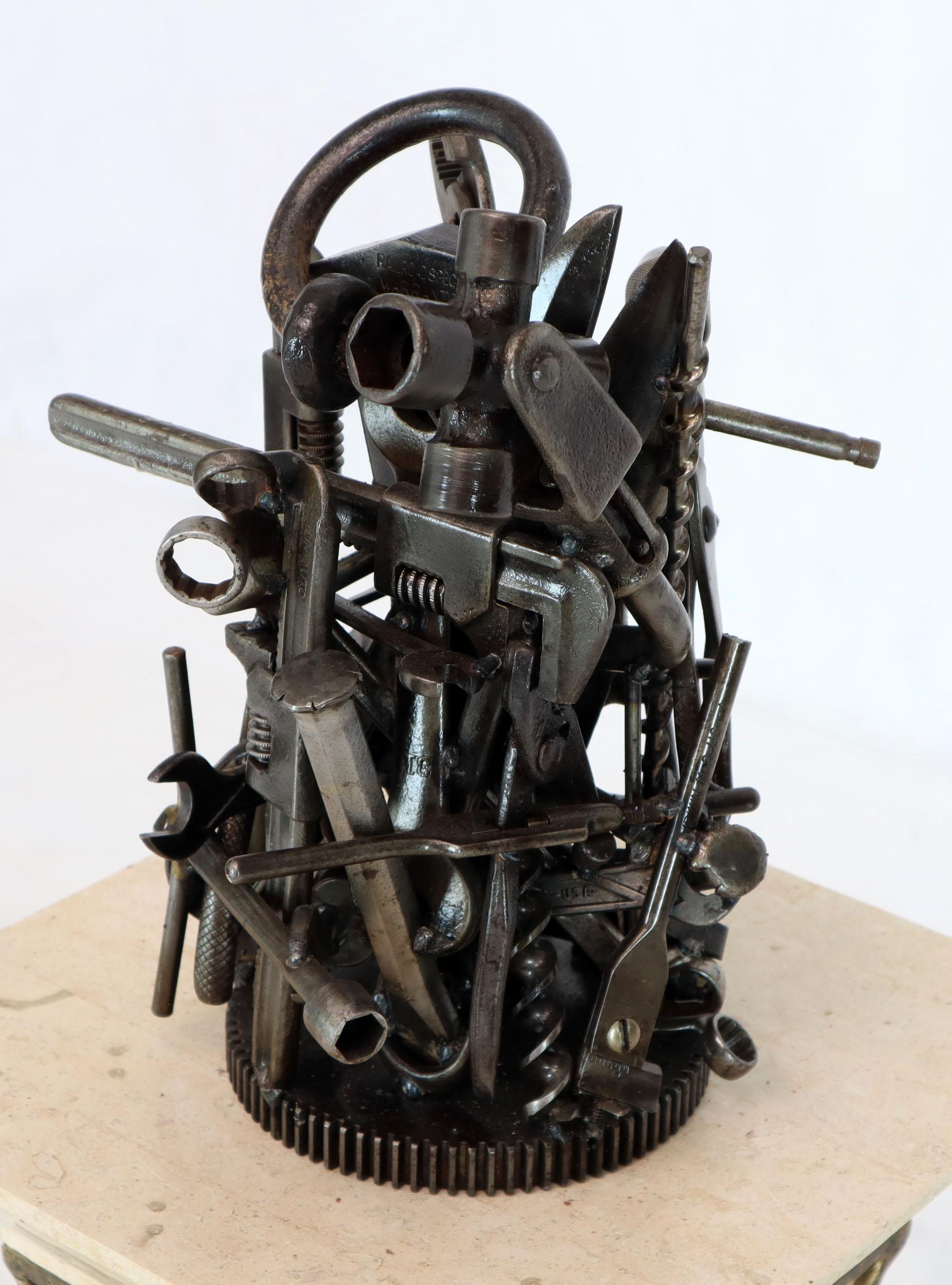 Modern sculpture of real and old welded together tools. In style of Feliciano Bejar. 



 
