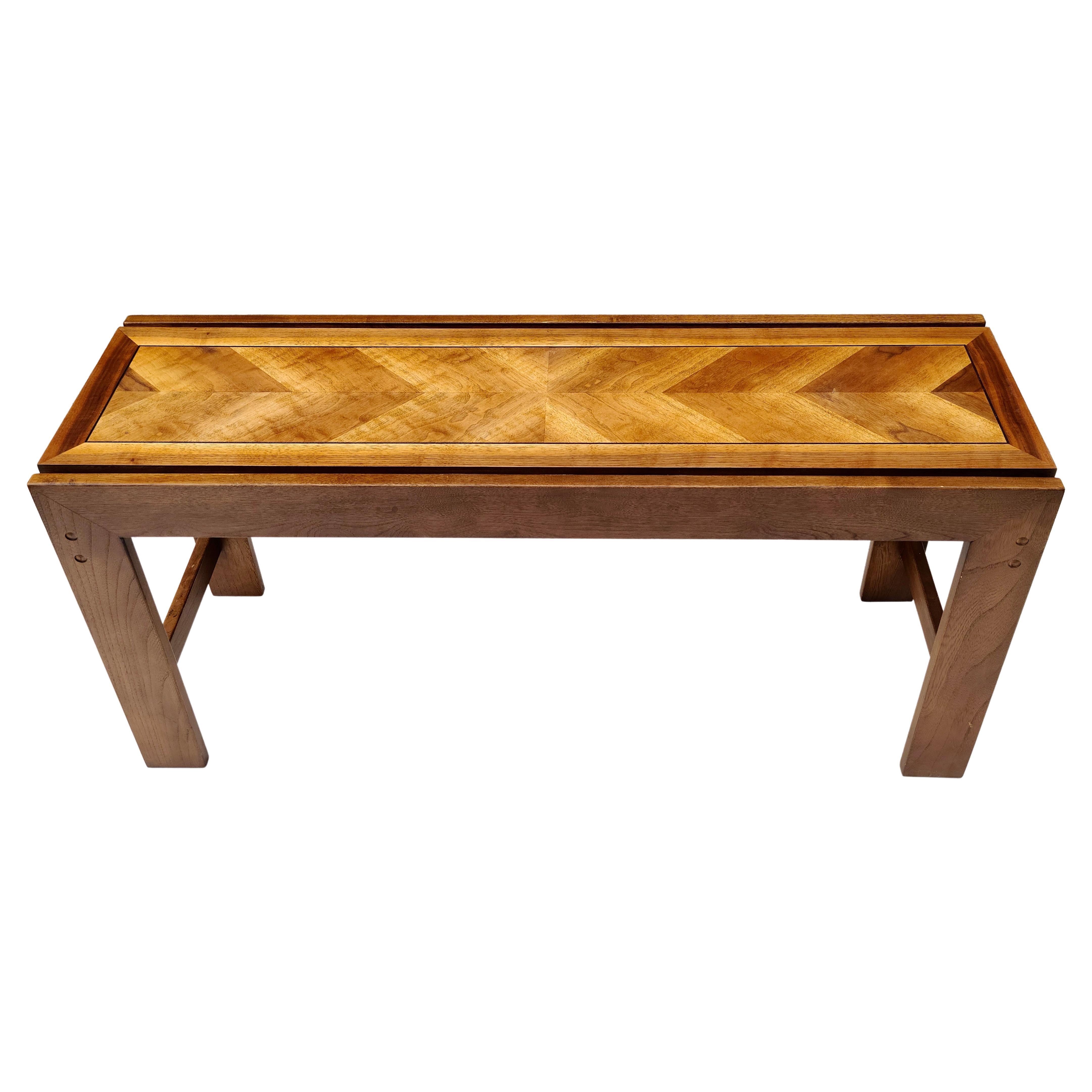 Please feel free to reach out for accurate shipping to your location.

Console Table By Lane.

Veneer is 4 way book matched. 
Looks lighter in one direction because of the propellor illusion.
Curly walnut pattern provides maybe another level of