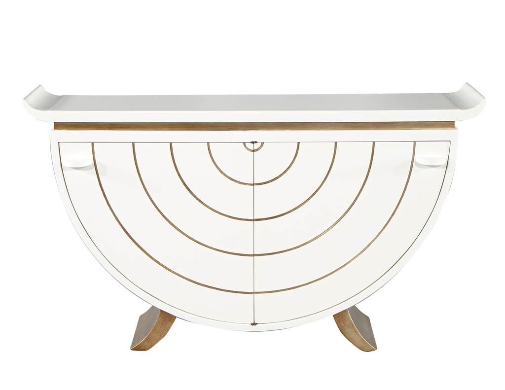 Modern Console Table Credenza by James Mont, circa 1960s, USA. Masterfully restored by the artisans at Carrocel in a semi-gloss white lacquered finish with hand painted gold accents. Sleek curves with iconic Mid-Century Modern, James Mont styling.