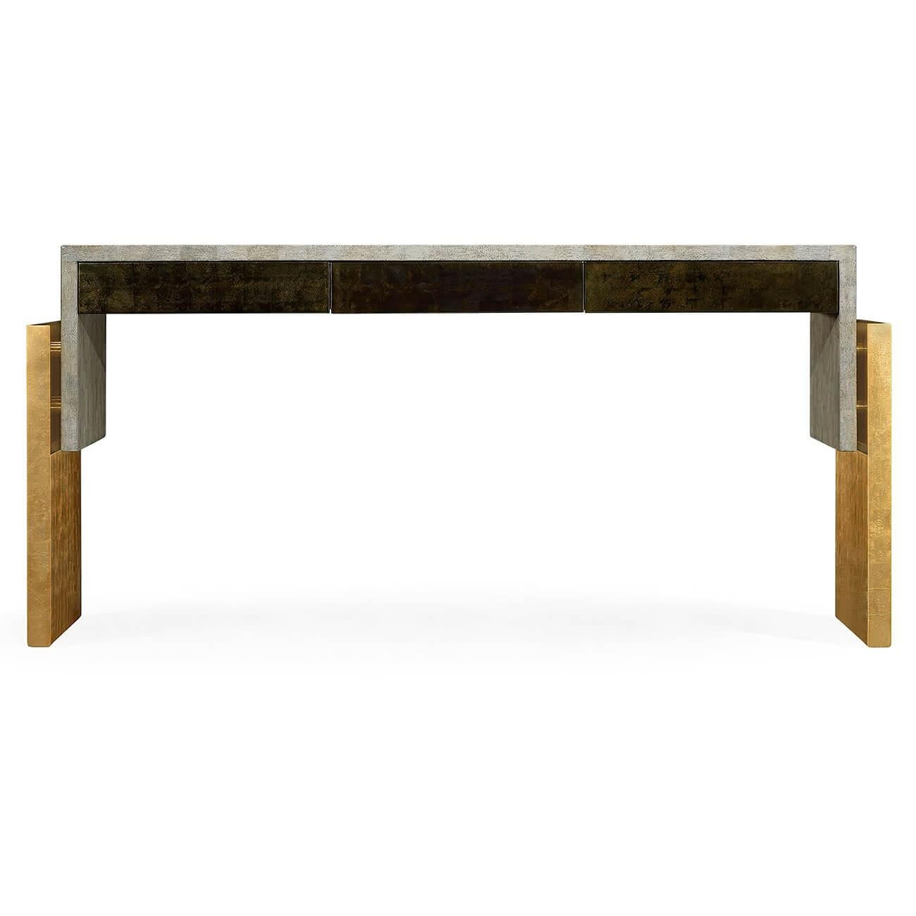 Modern console table with a floating top, the top finished in a bone eggshell with three drawers in a bronzed finish, supported by gilded sections.

Dimensions: 63 7/8