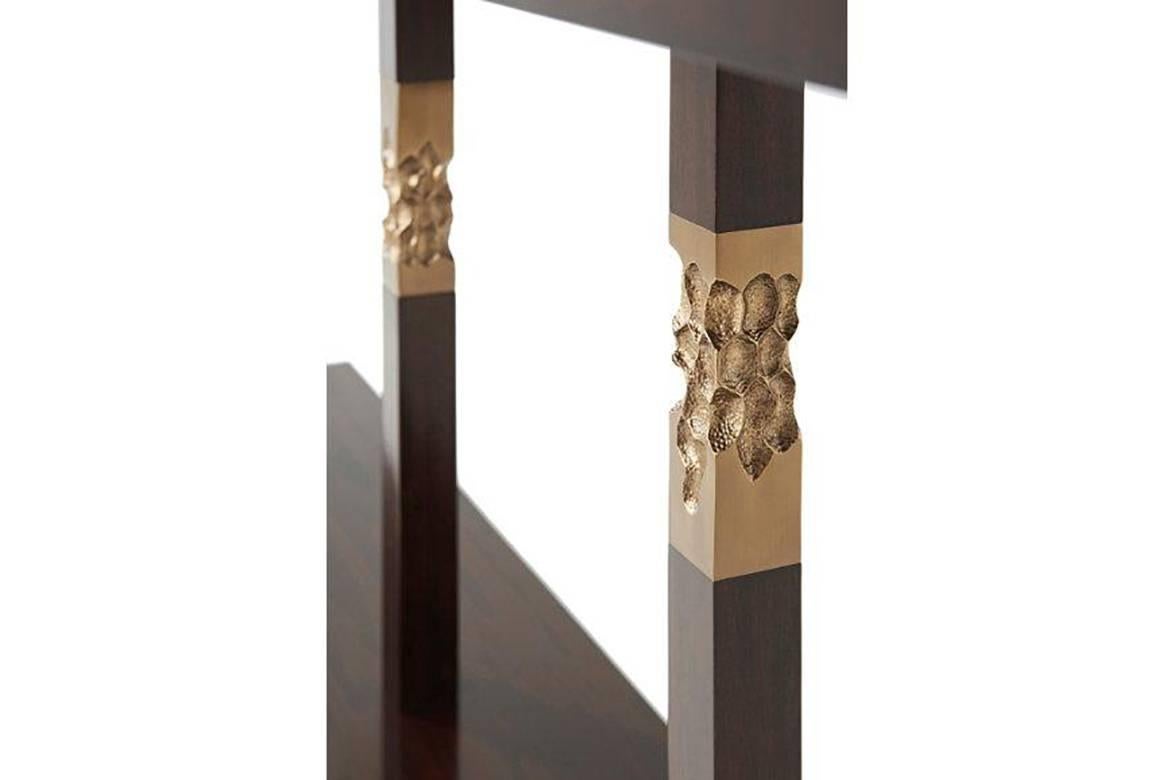 Modern console table with solid mahogany and veneer in an espresso finish with textured brass accented square brutalist columns.
Dimensions: 80