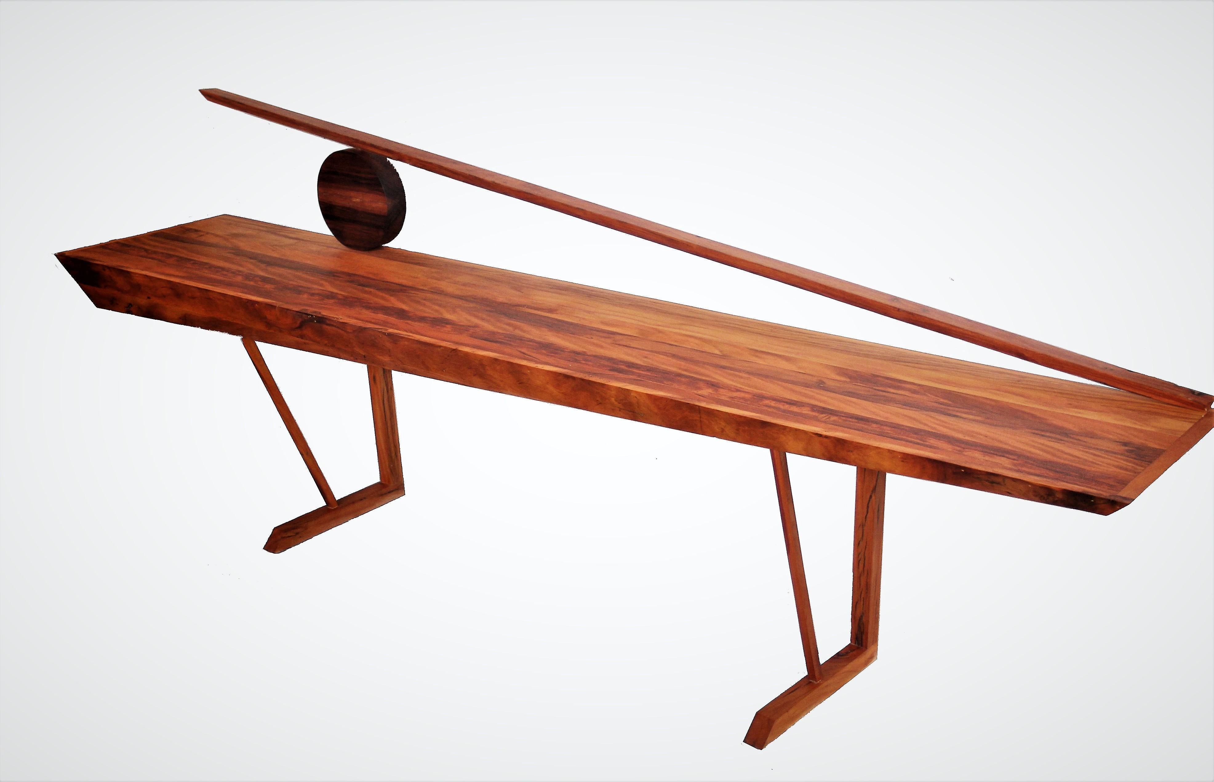 A modern style console table in hardwood. The Orum, Sun in Yoruba.

With bold shapes, Brazilian noble timbers invite the spectator to use their imagination.

Sunrise or sunset, a horizont, boats, there are no limits to travel.
 