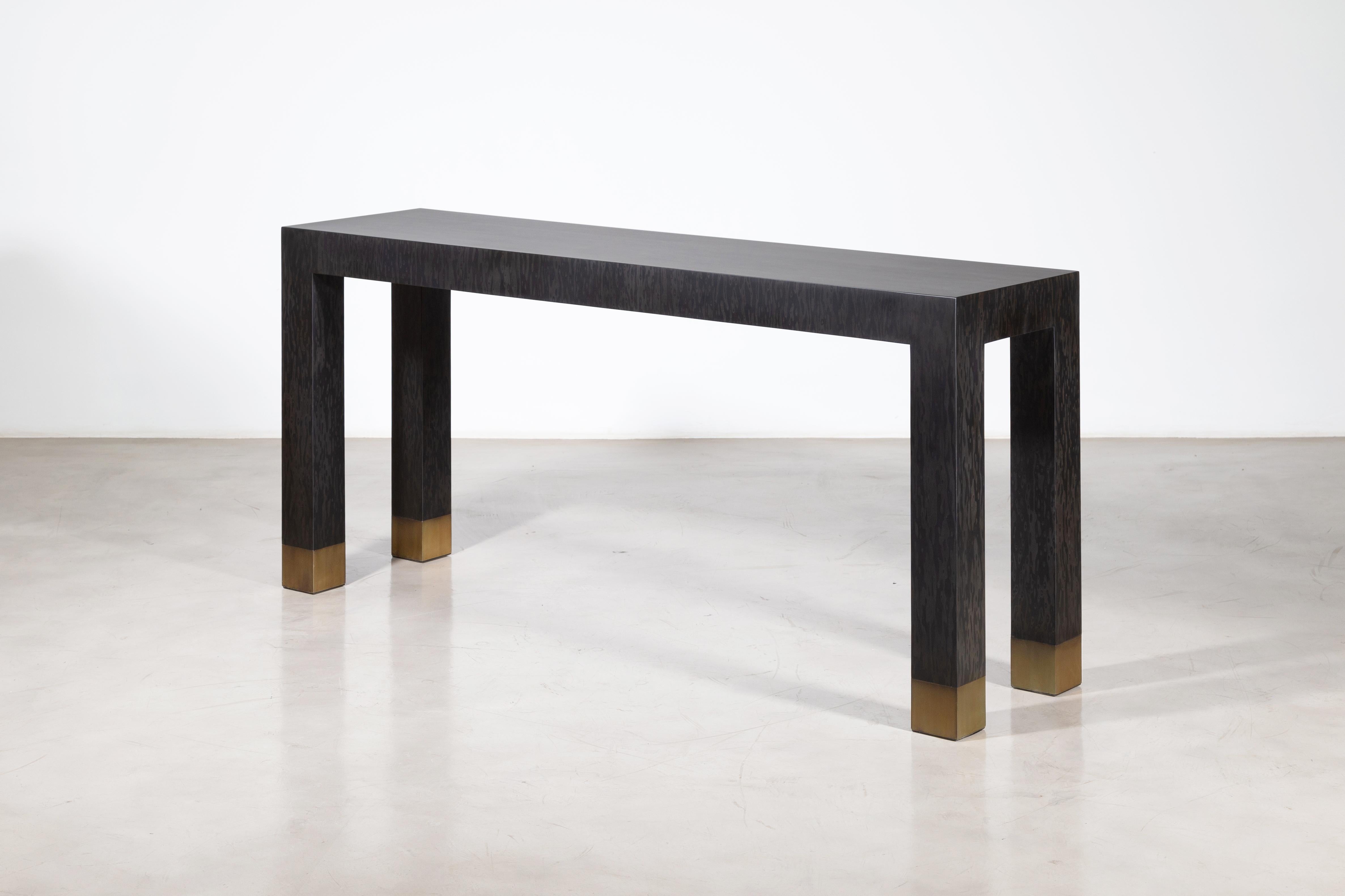 Dino Modern console table with bronze sabots in black maple wood by Costantini

Measurements are 90