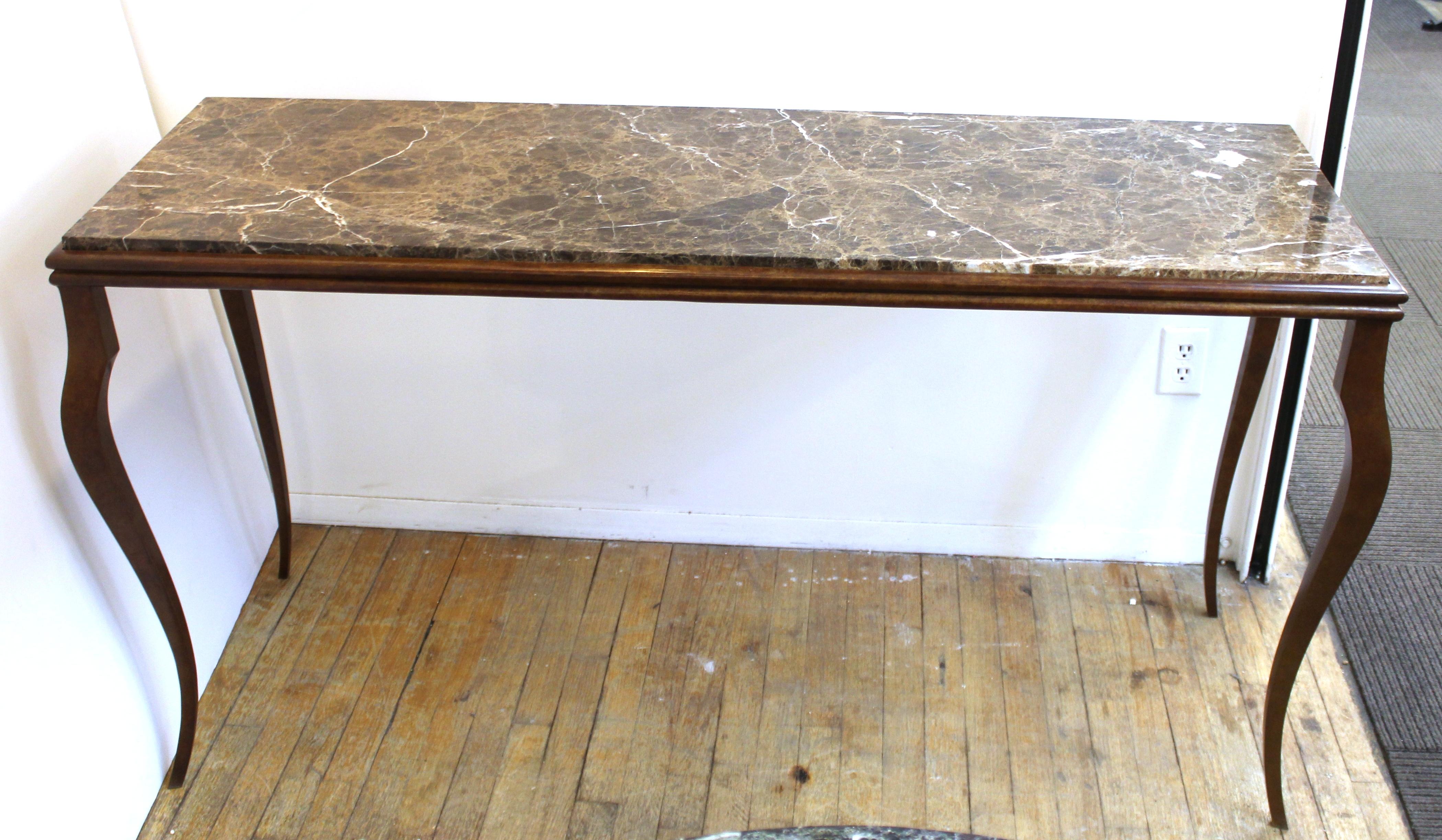 Modern console table with bronze structure and cabriole legs and a marble top. The piece is in great vintage condition with age-appropriate wear.