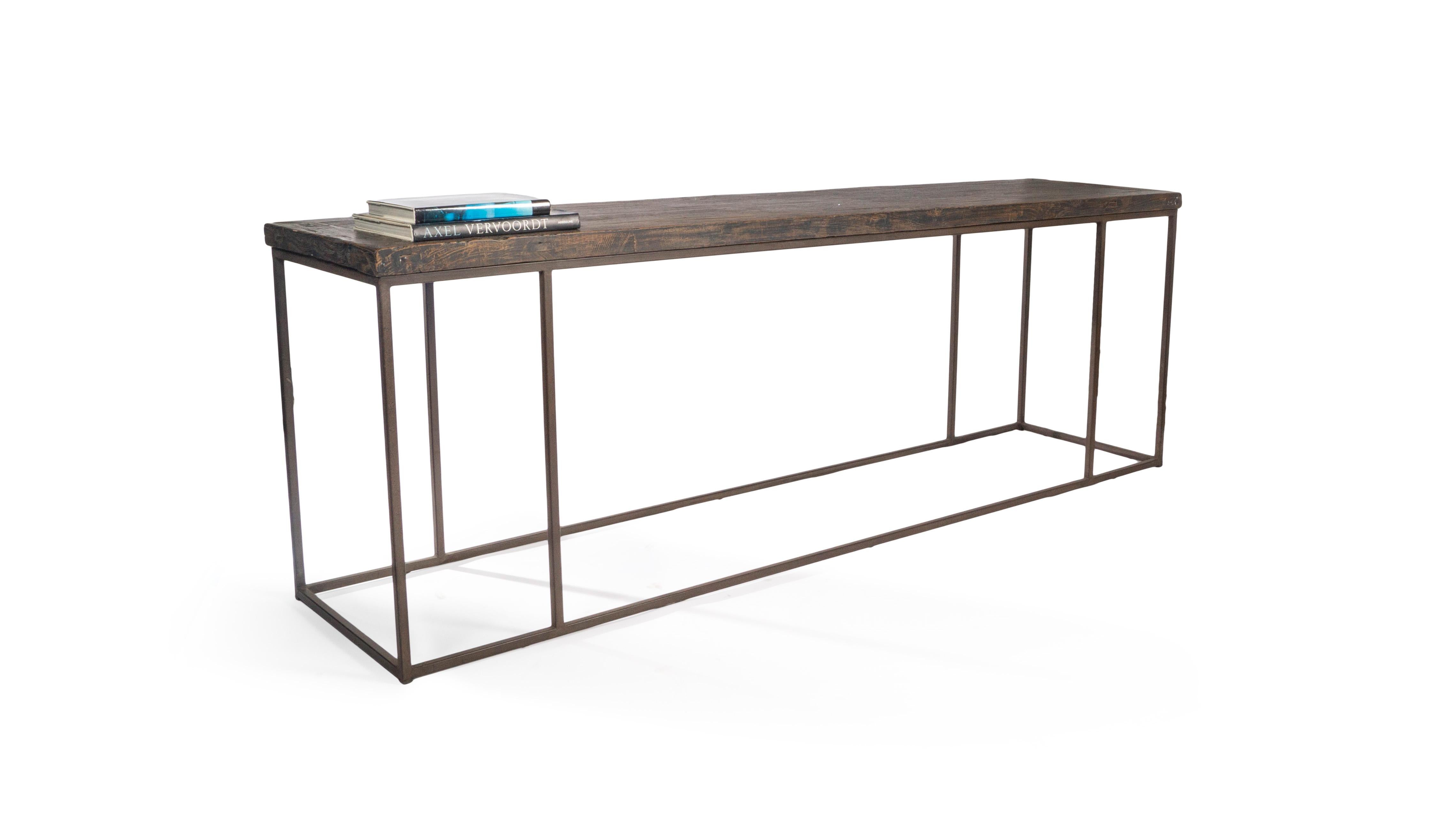 This large console featured a modern steel base and wide reclaimed elm top. This top features a charcoal toned finish that reveals the natural undertones of the wood.

This piece is a part of Brendan Bass’s one-of-a-kind collection, Le Monde.