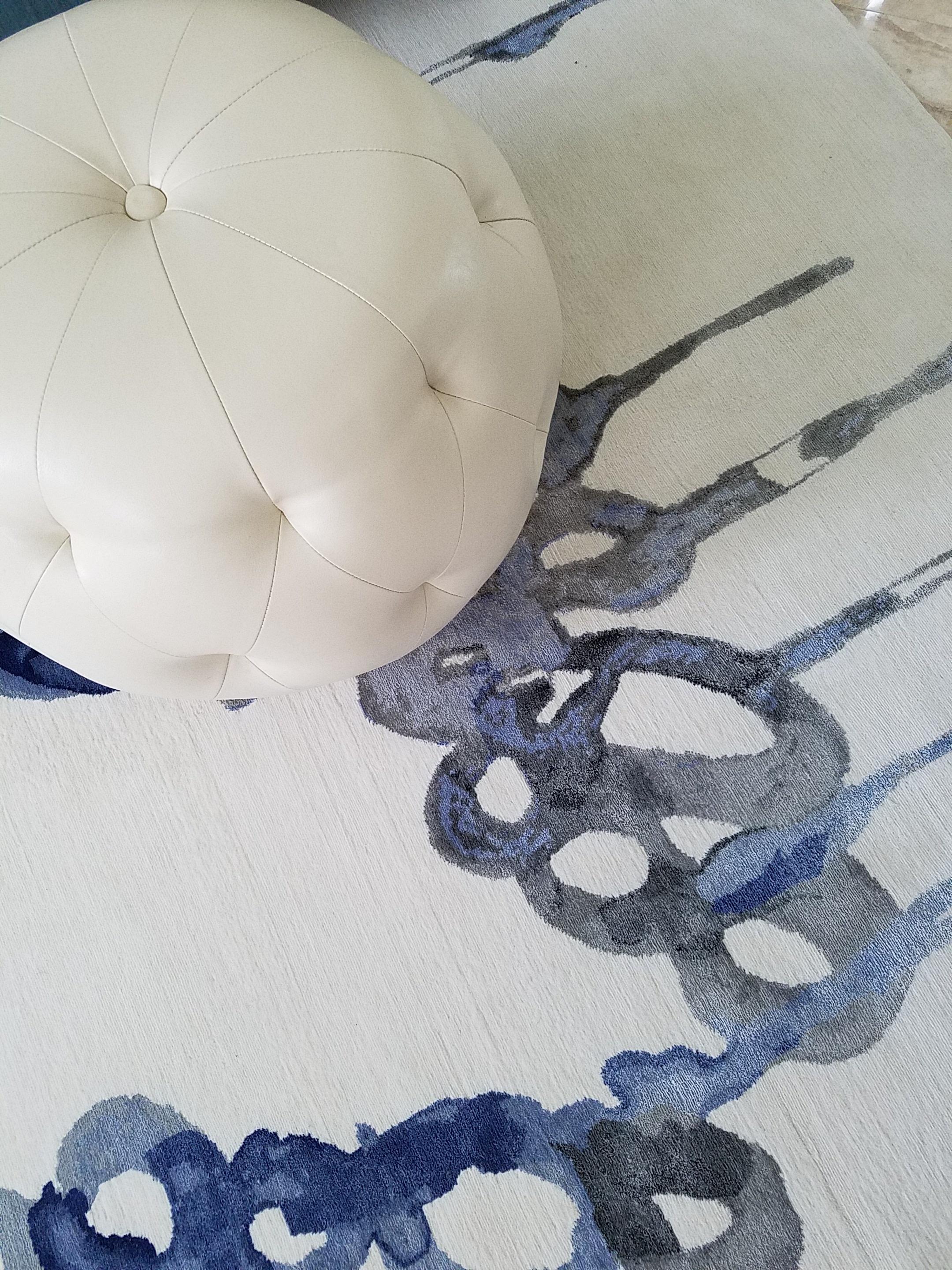 Playing with ambient blues and water lead the designer to an entirely new heights of artistic expression. A painting turned into a stunning piece resembling liquid art, blue mood rug evokes whimsy and wonder. Unmistakably alluring texture thanks to
