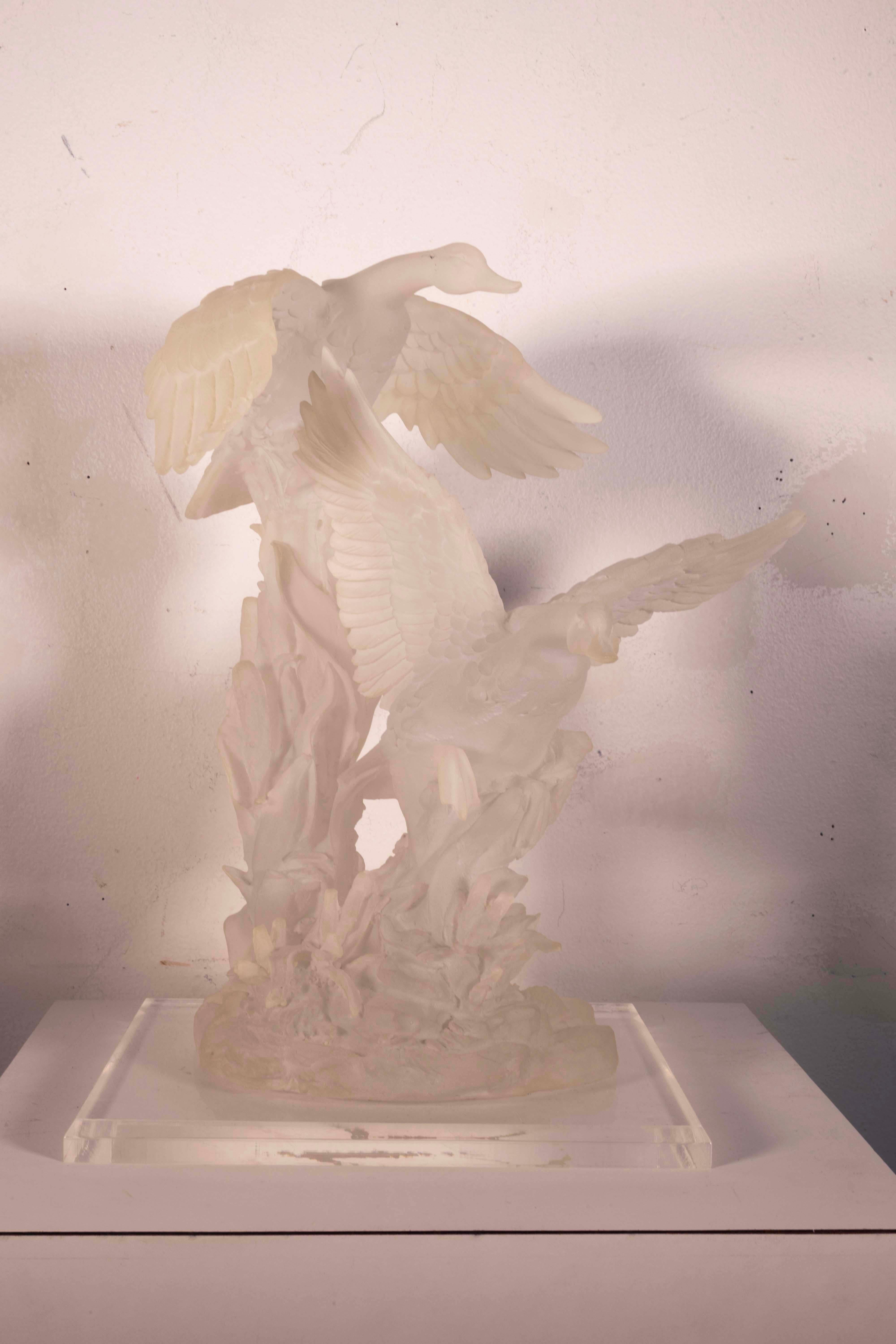 A classic modern contemporary carved acrylic sculpture depicting geese in flight. A dynamic composition with movement and energy. Artist unknown. From a private collection. Dimensions: 13.5”h x 11.5”w x 7.5”d. In exceptionally good vintage