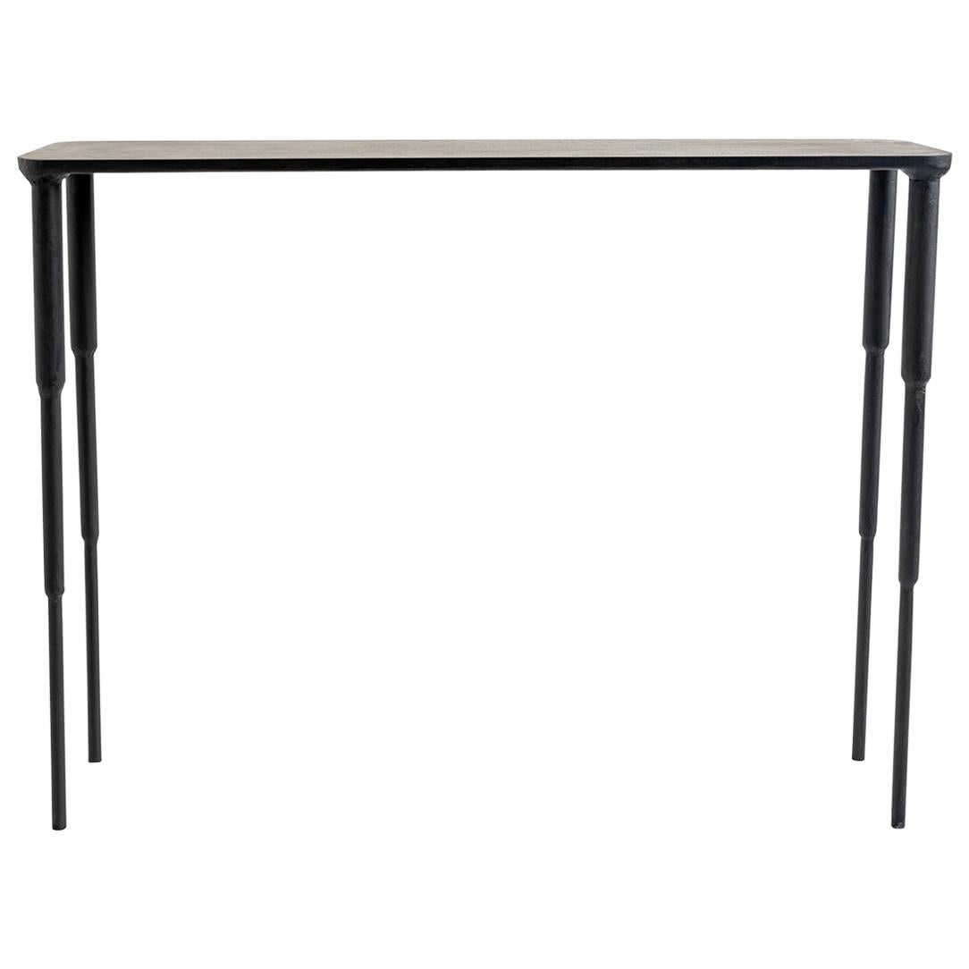 CONSOLE NO. 2 
J.M. Szymanski
d. 2018

A refined and sleek design, this console table is carved out of blackened and waxed steel. The legs are finely tapered and make this elegant console table stand out. 

Custom sizes available. Made in the Bronx,