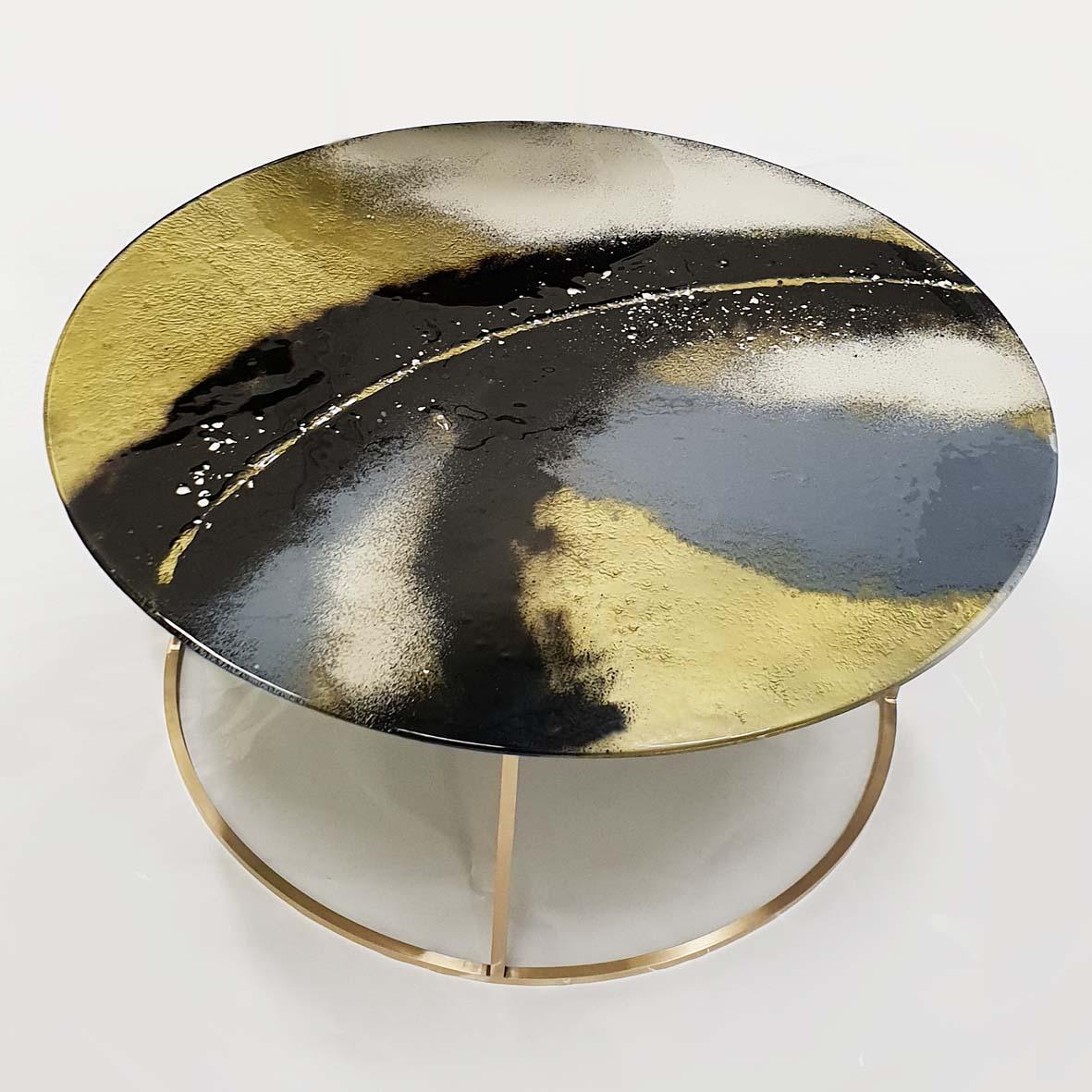 Contemporary and modern round coffee tables with Murano kind handmade glass colored using metal oxides in black and grey and liquid metal in gold color. Limited collection signed by Edith Baranska. Each piece is unique and a bit different due to the