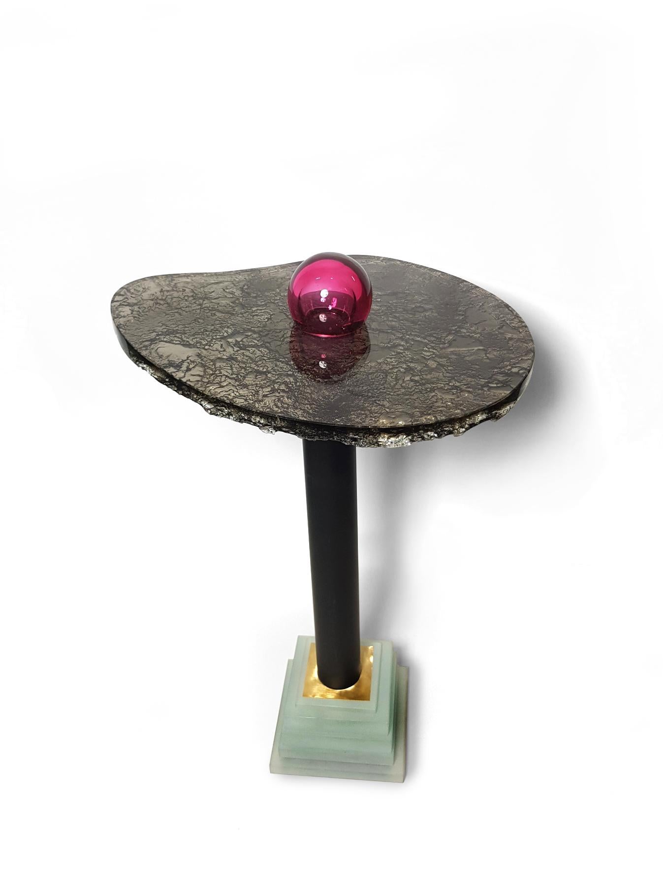 The artist, moved by stories from fairy tales read to her daughter, decided to create a collection of tables and lamps, a bit fleeting as soap bubbles. The shapes used in the designs are based on light ovals or balls, emphasized only by color.