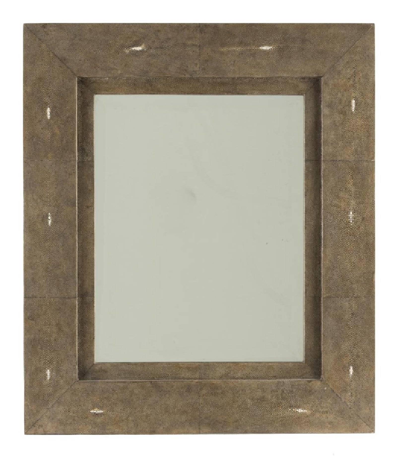 Contemporary modern mirror
Maker's plaque to back: R&Y Augousti / Paris
The rectangular plate within a ray skin veneer frame; can be oriented in portrait or landscape configuration
Measures: 27.5