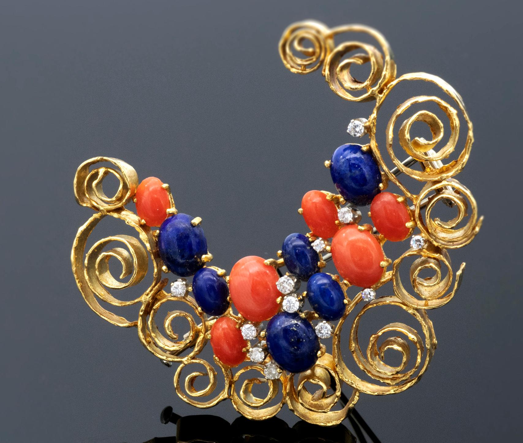 An original 1970s piece, this moon crescent designer brooch is a quintessential representation of the era's exuberant approach to jewelry design. Crafted from textured 18 karat gold, its intricate swirls evoke a filigree-like airiness that speaks to