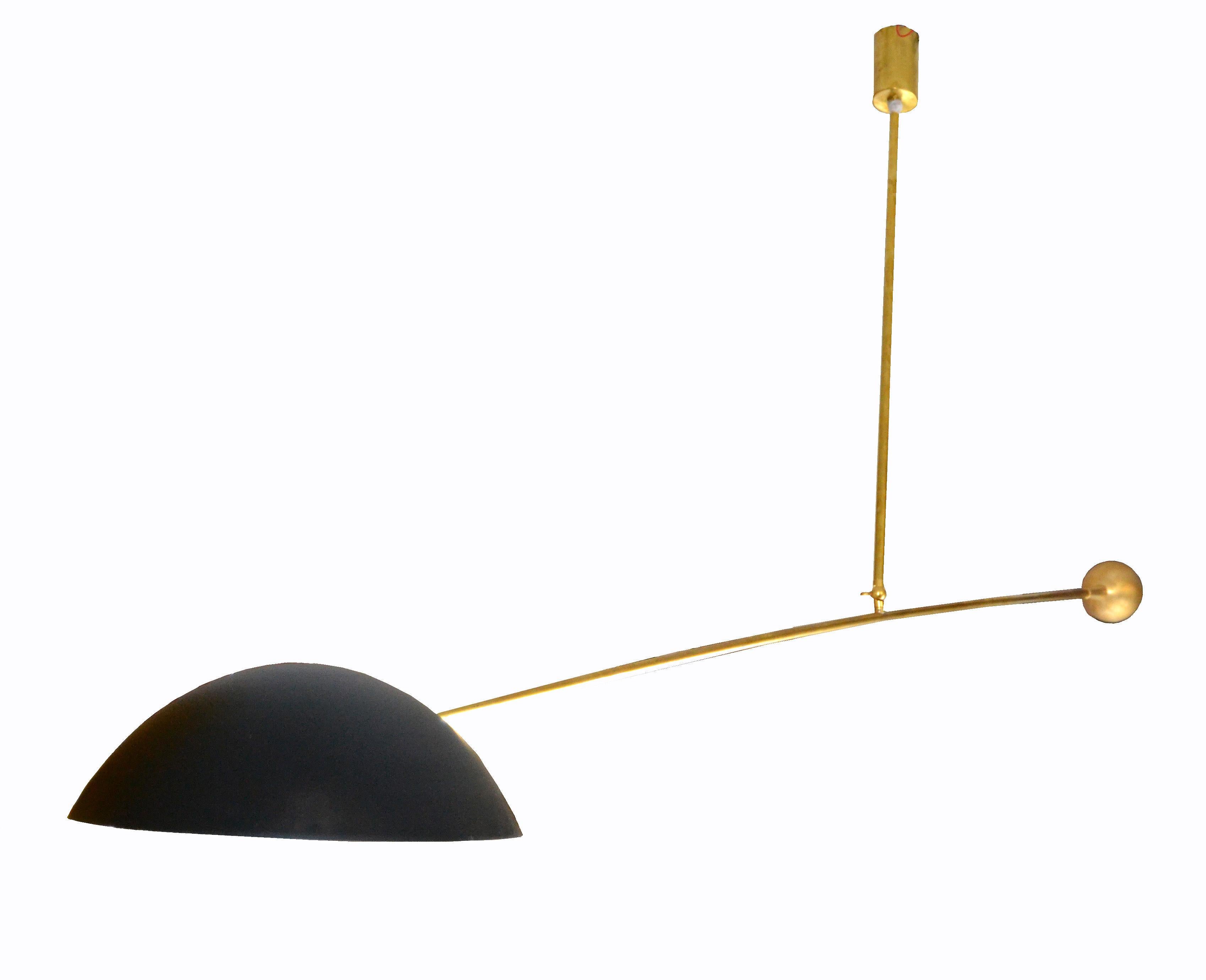 Solid brass Italian modern counter-balance ceiling light fixture, in the style of Stilnovo, with a black enamel shade.
Wired for the U.S. and uses a max. 60 watts light bulb as well as LED bulb.
This light fixture is always in the center of