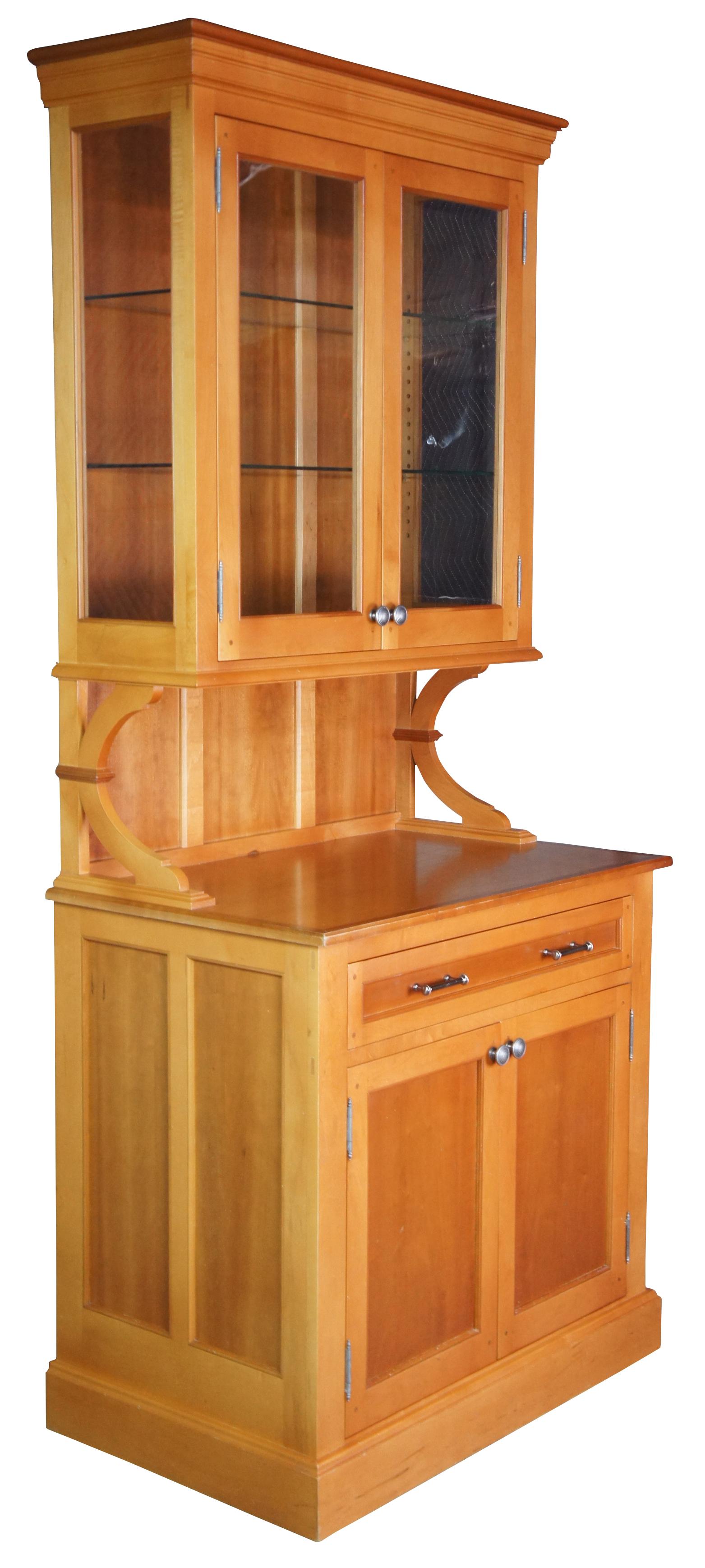 Vintage modern hutch, bar back or server. Made of maple featuring one drawer, paneled sides with lower cabinet and upper glass curio or china display. One piece, does not break down.

36