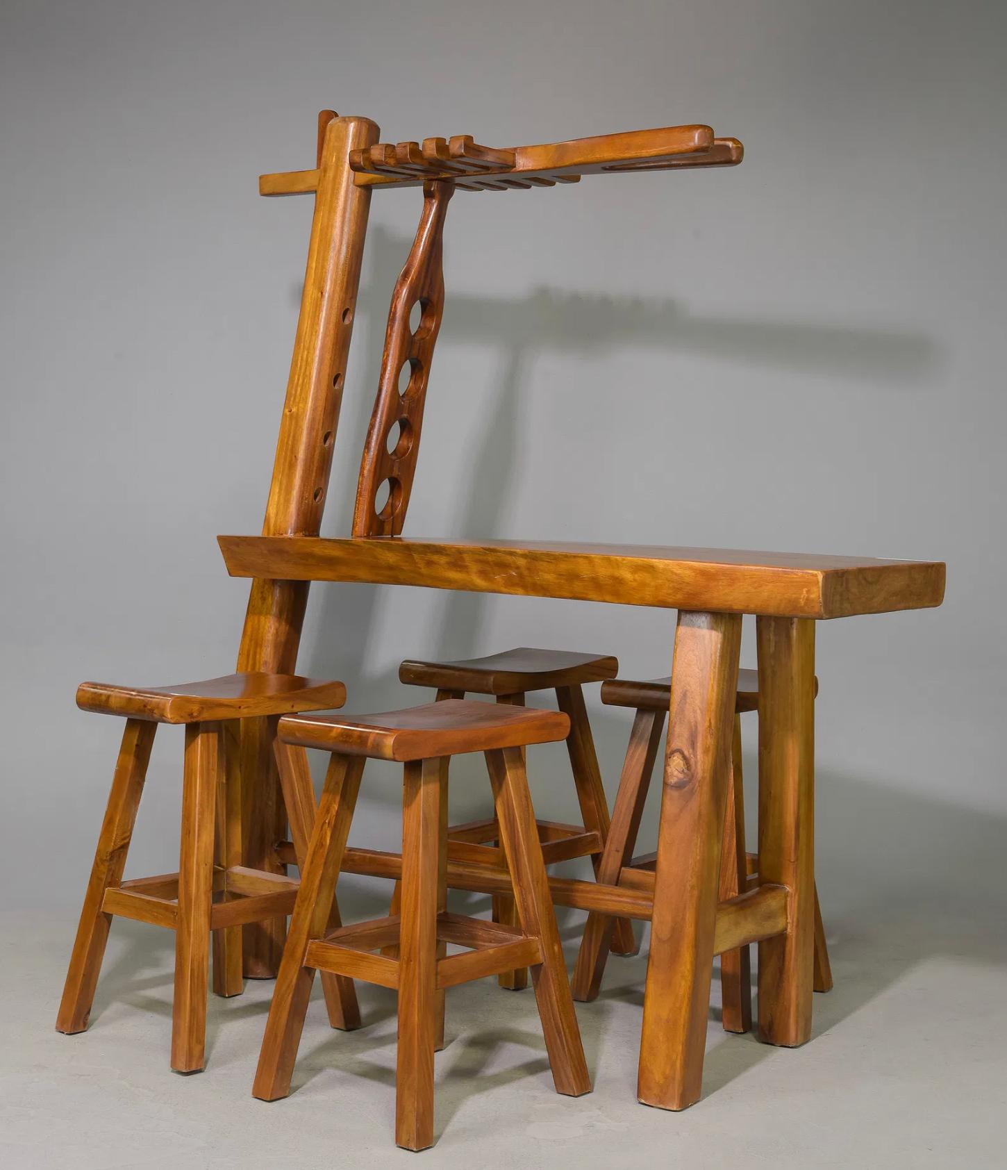 Beautifully crafted live edge bar table paired with matching stools in a rustic farmhouse style. The bar includes built-in storage that holds multiple wine bottles and glasses, combining function with timeless design.
The stools measure 29.5