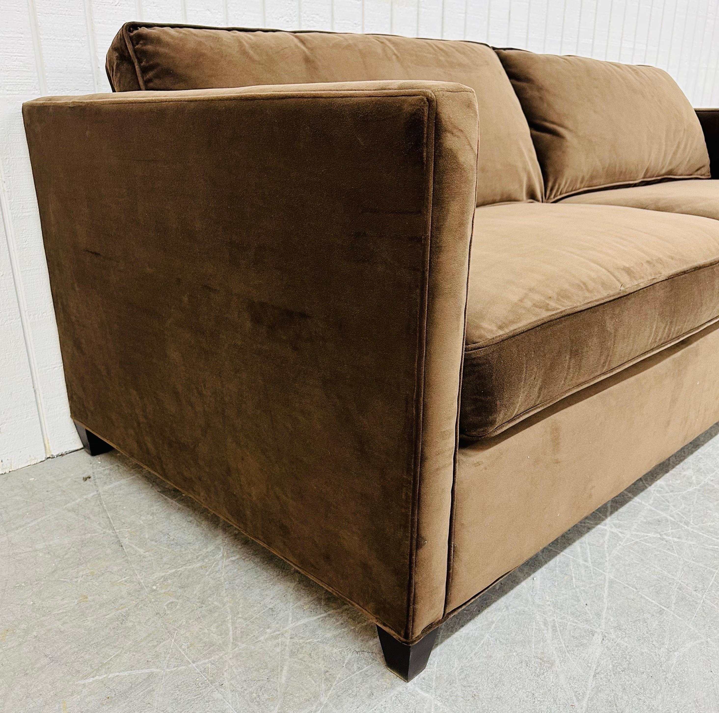 This listing is for a Modern Crate & Barrel Chocolate Sofa. Featuring a straight line design, two large cushions for seating, removal back pillows, black modern legs, and a beautiful chocolate color. This is an exceptional combination of quality and